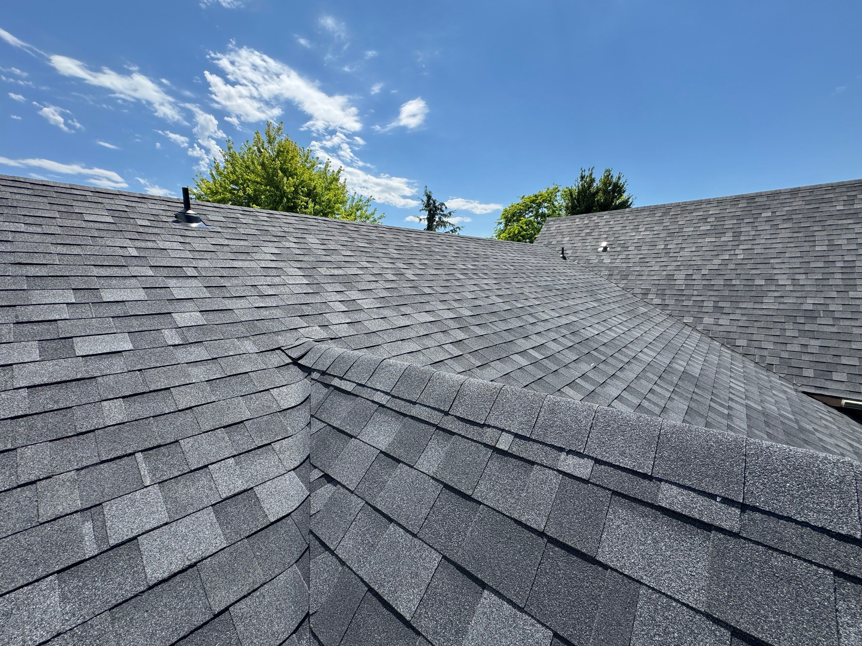 Residential Roof Replacement Featuring Charcoal Grey Architectural Shingles by Olive Roofing
