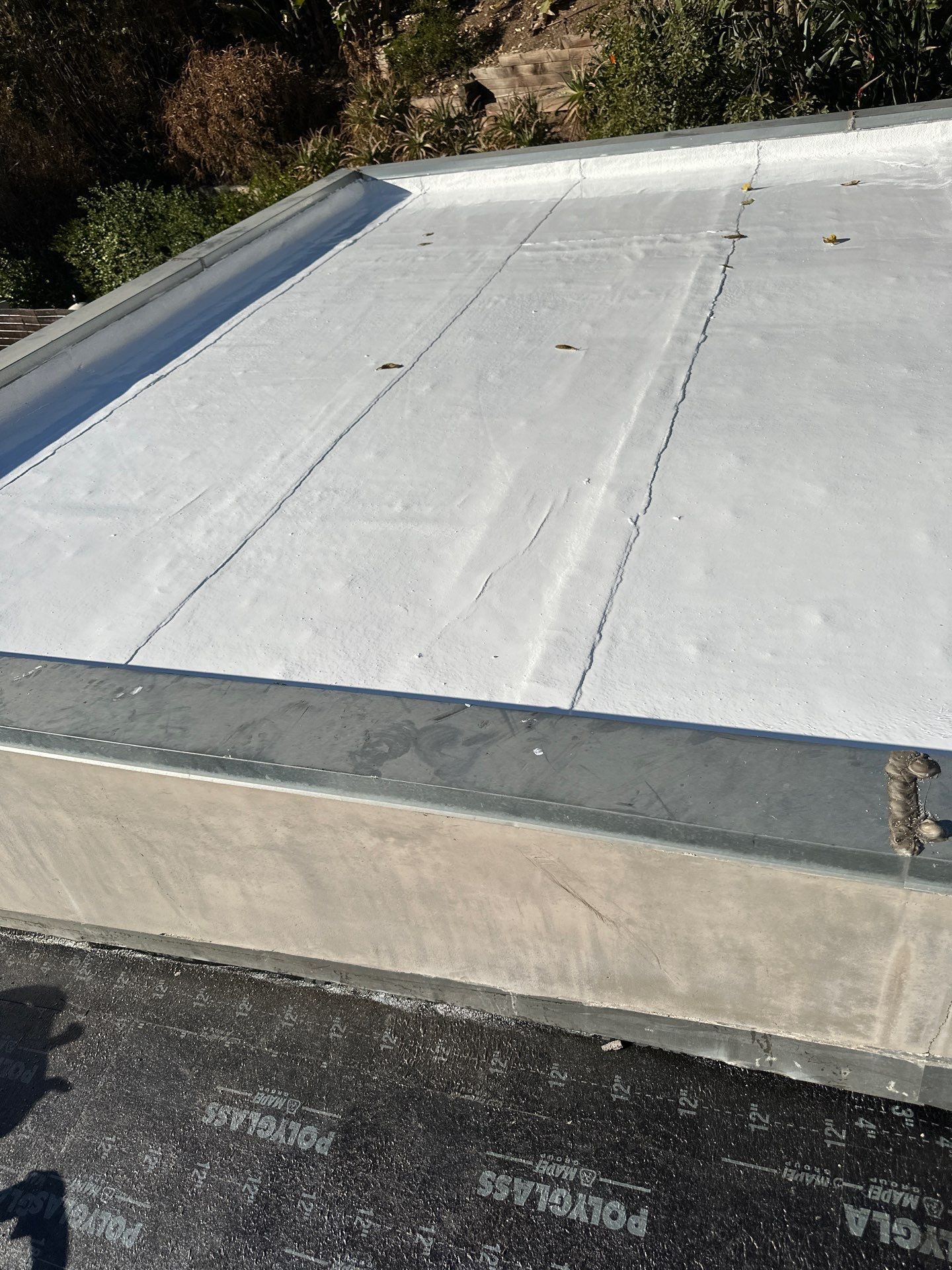 Residential Roofing Installation using Polyfresko® G Highly Reflective Modified Bitumen Cap Sheet by Hull Brothers Roofing