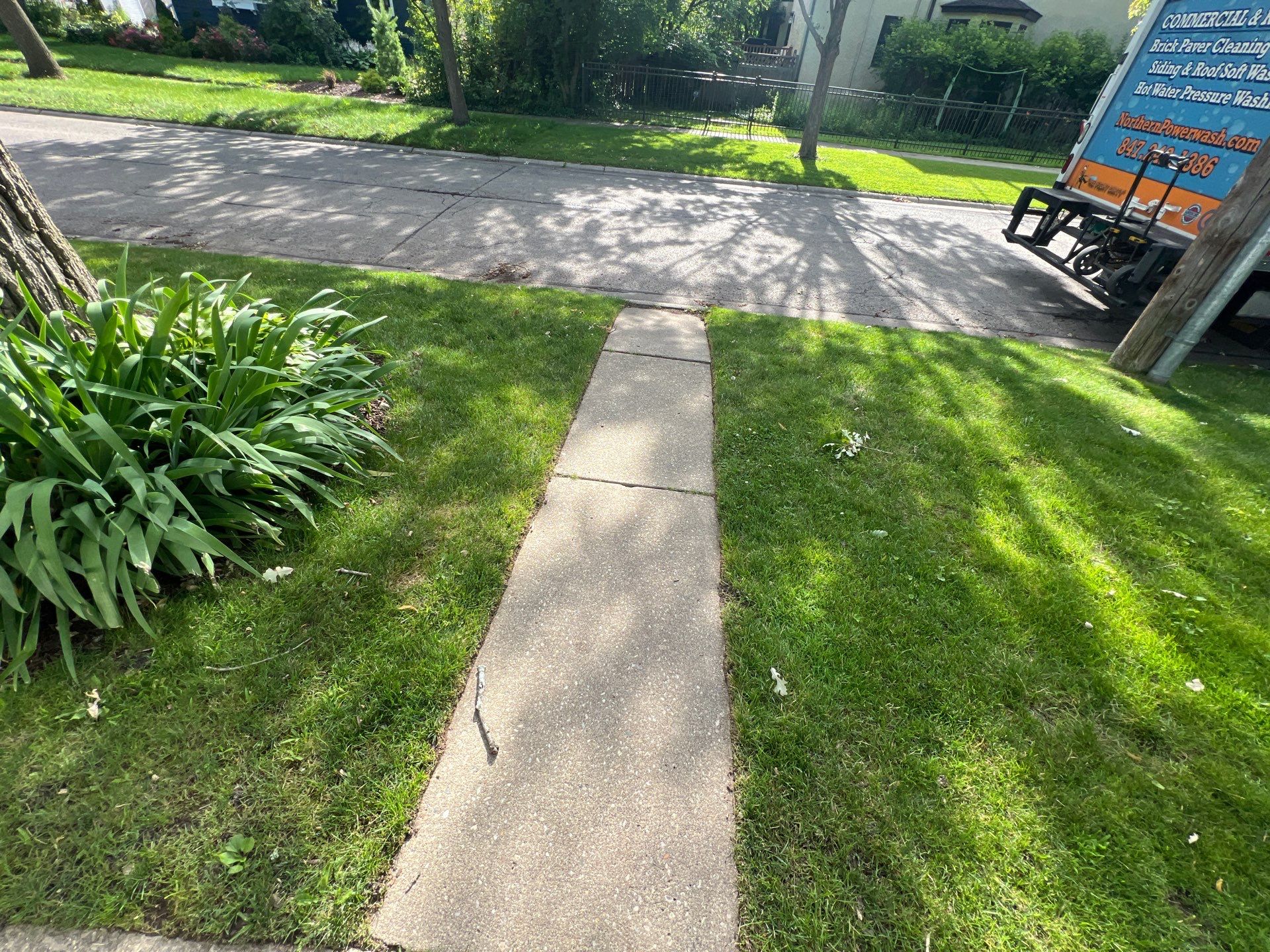 concrete cleaning using Algaecide, soft wash soap by Northern Power Washing LLC.