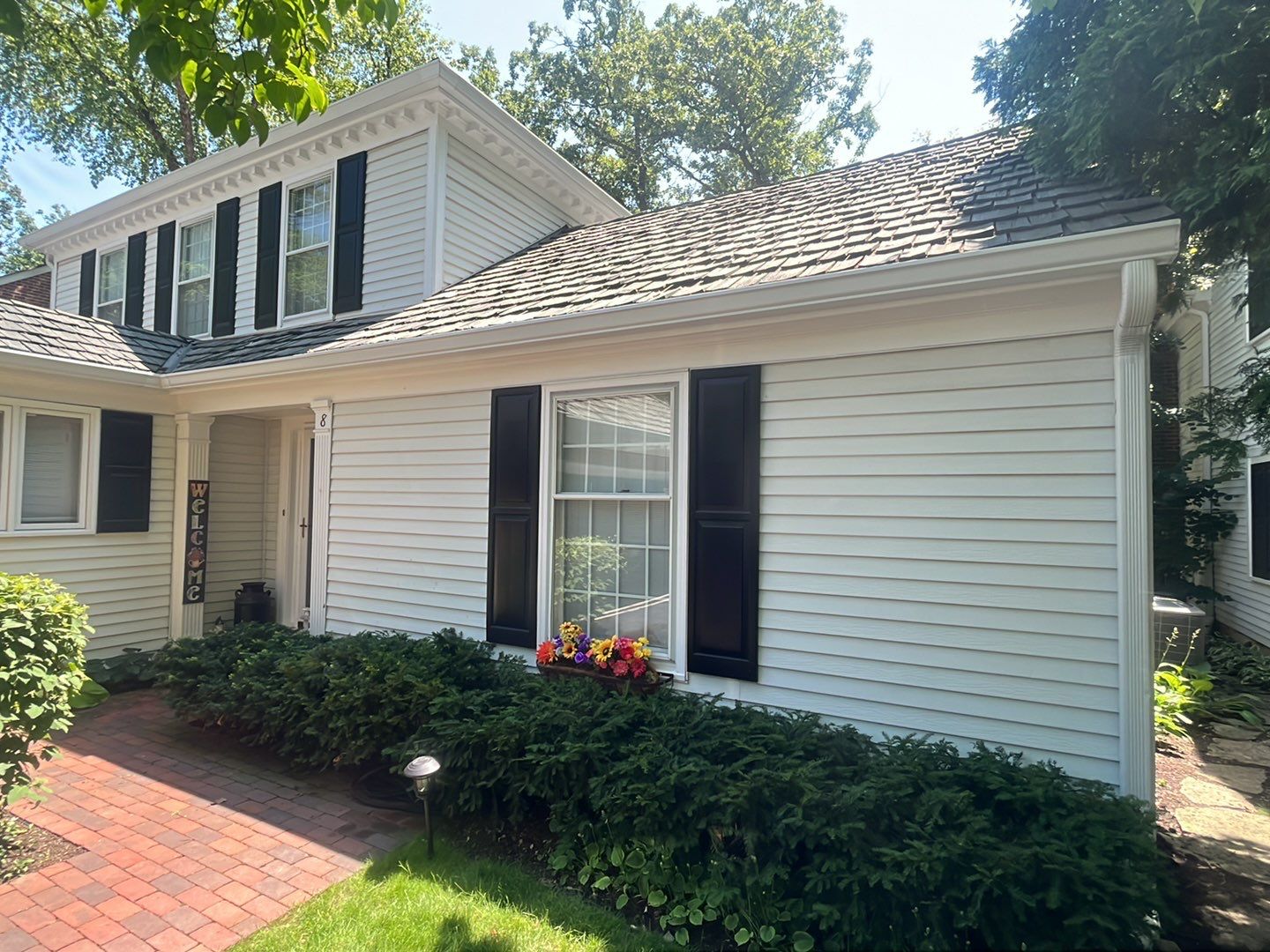 Housewashing  using Algaecide, soft wash soap by Northern Power Washing LLC.