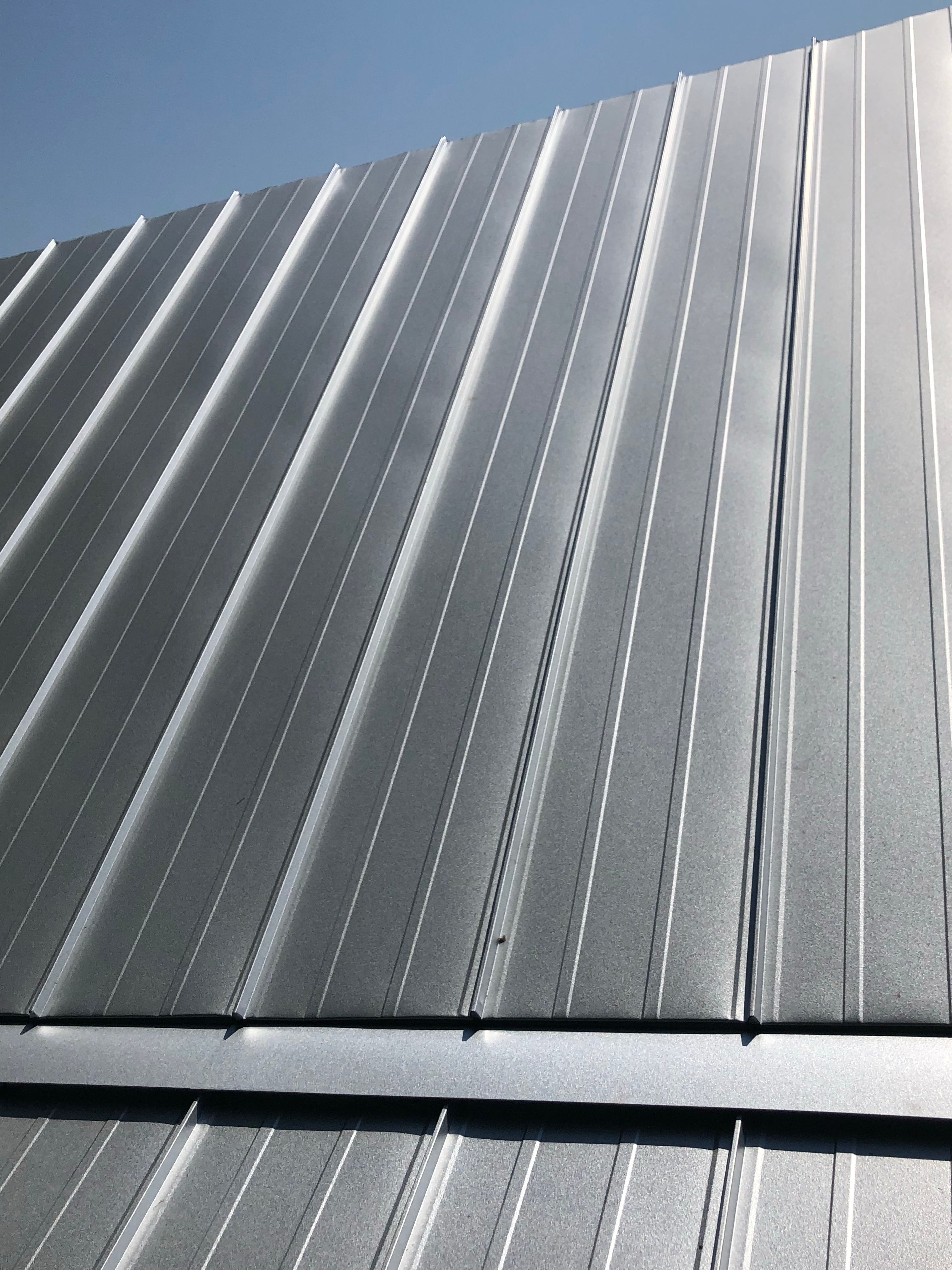 Residential Roofing Installation using Metal roofing by American Roofing & Construction LLC