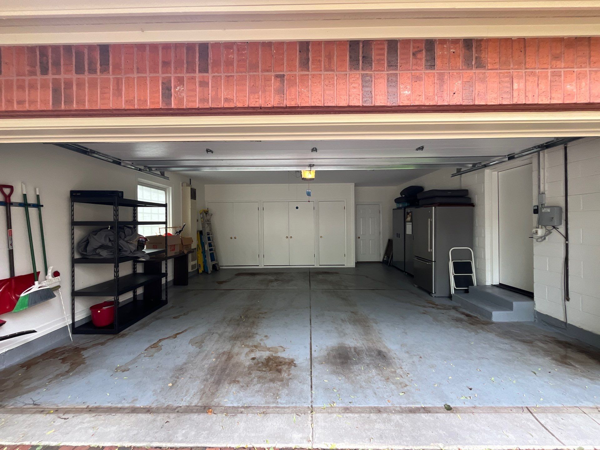 epoxy garage floor cleaning using degreaser by Northern Power Washing LLC.
