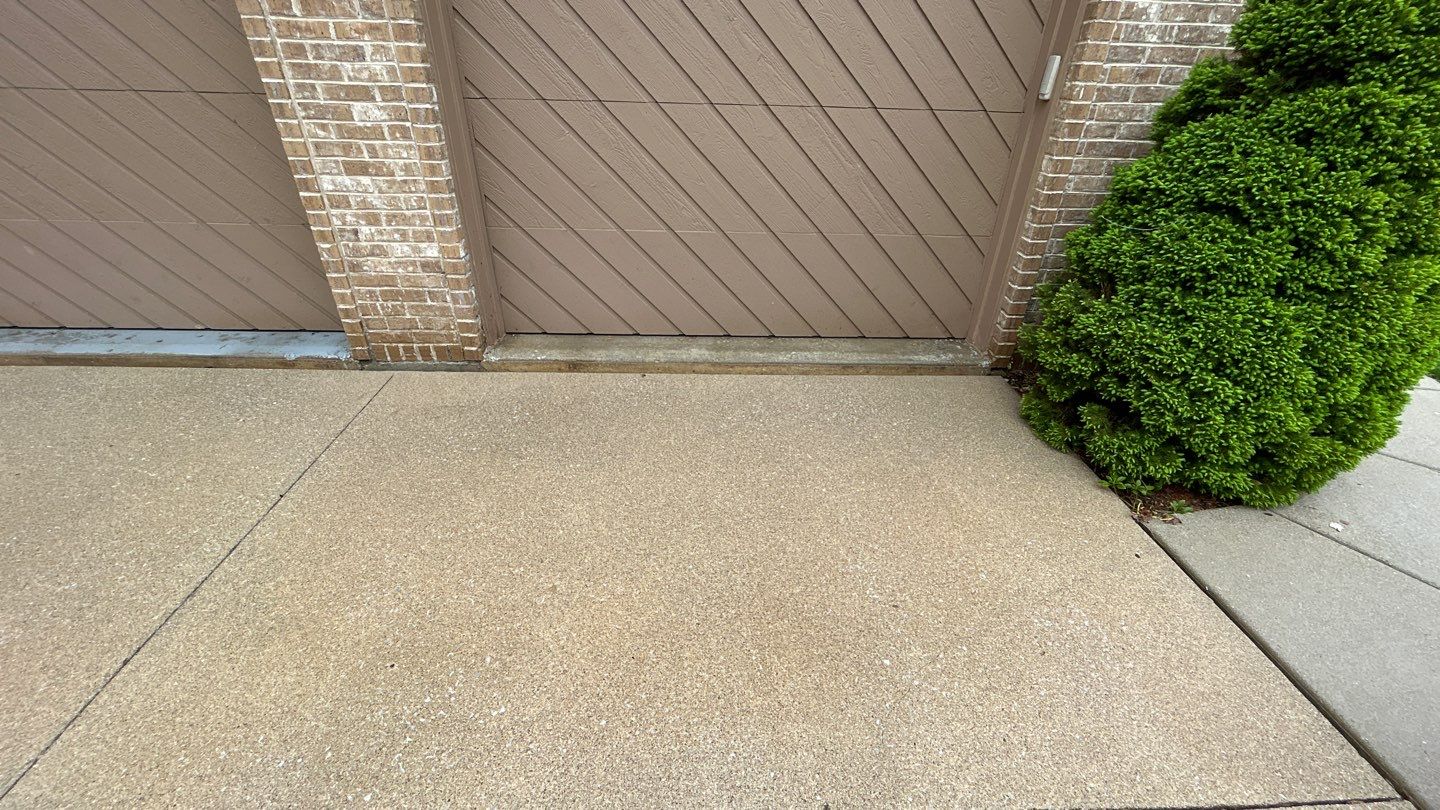concrete patio and driveway cleaning by Northern Power Washing LLC.
