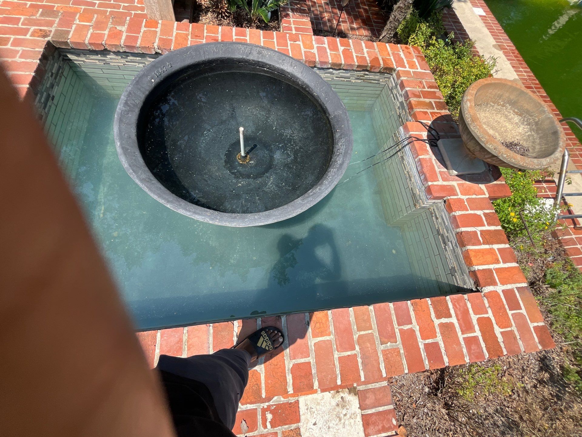 Pool Cleaning using Pool Cleaner by College Bros Outdoor services