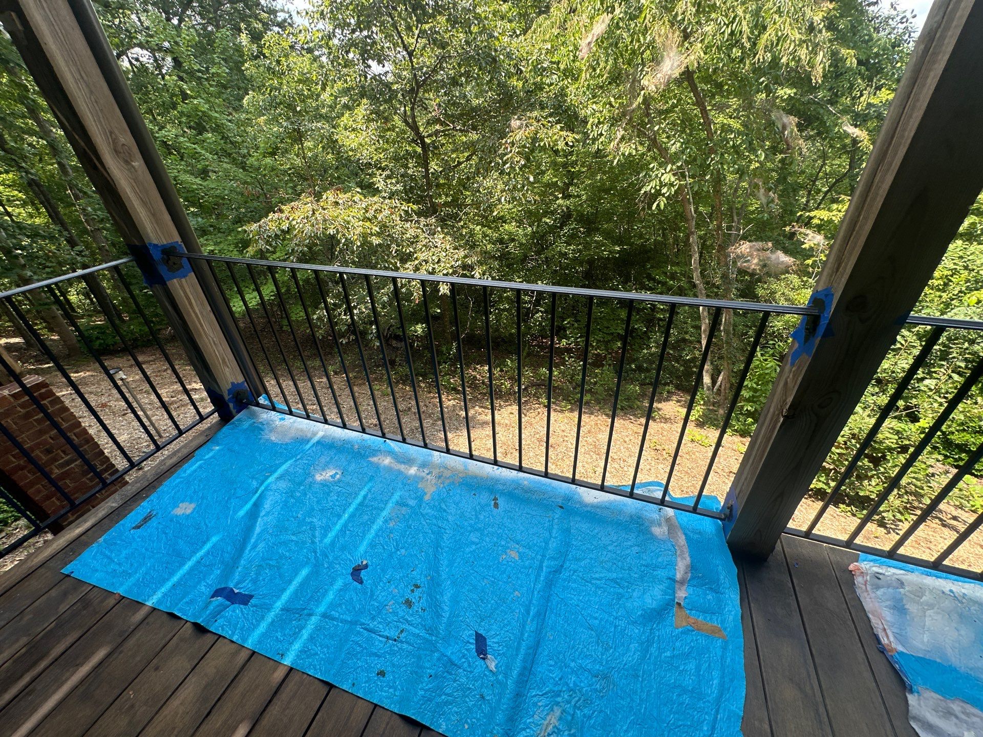 Wood Deck Refinishing and Black Metal Railing Upgrade in Travelers Rest by Painter1