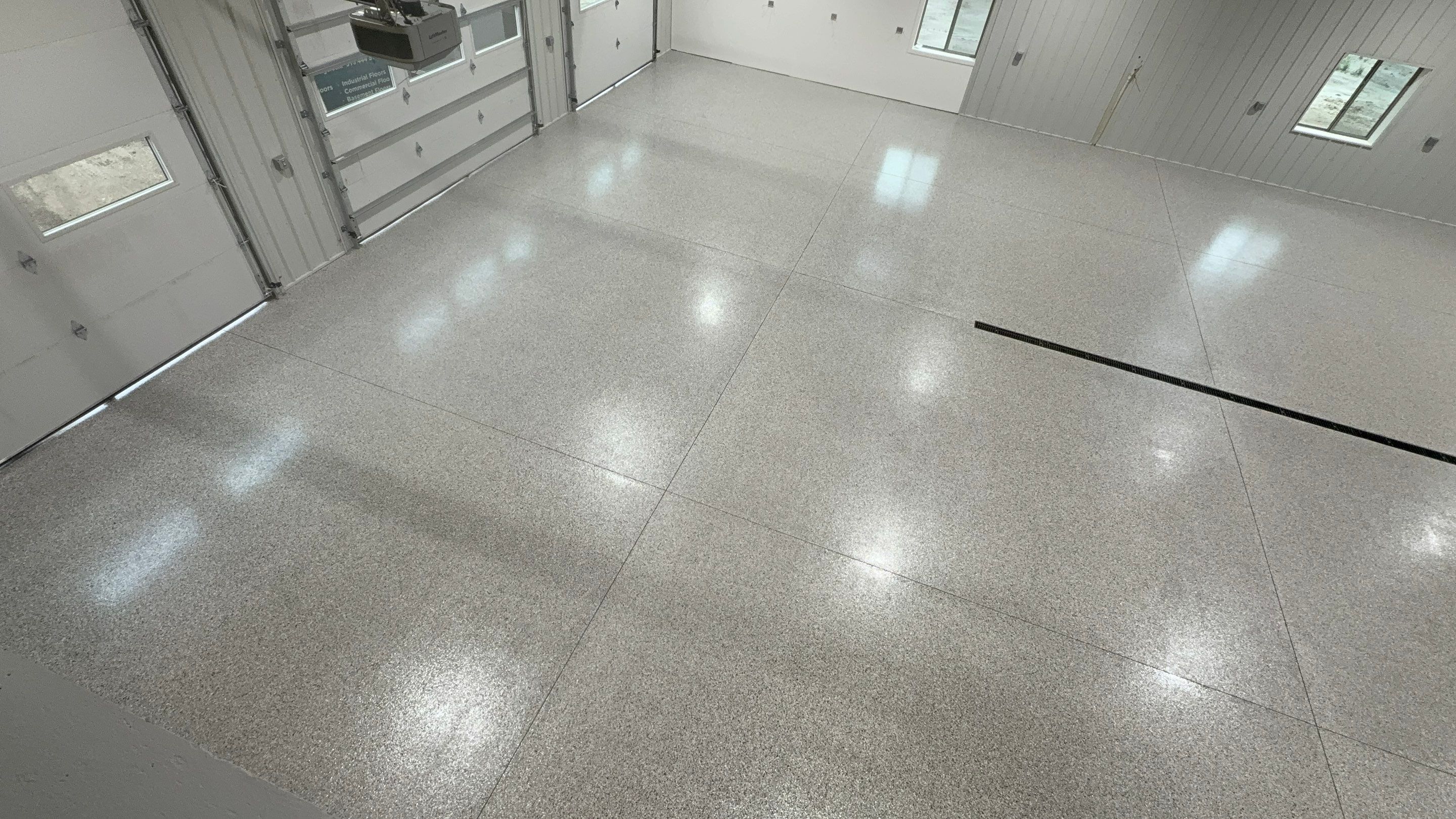 Custom Speckled Floor Coating for Large Montrose Shop by Select Painting, Coatings & Garage Cabinets