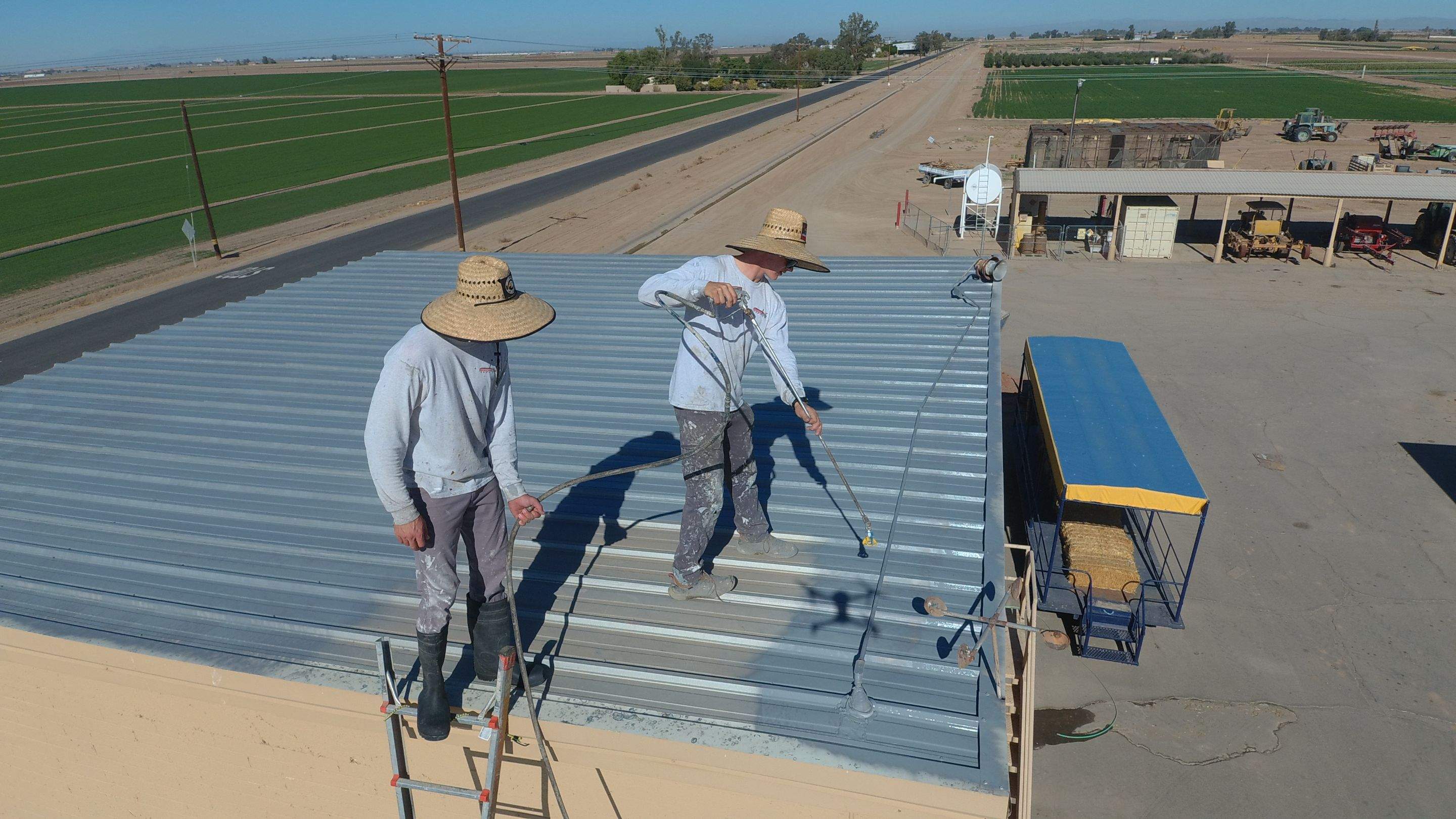 Metal roof restoration on commercial roof using Conklin Benchmark/PUMA XL fabric and coating by Straight Edge Roofing Inc