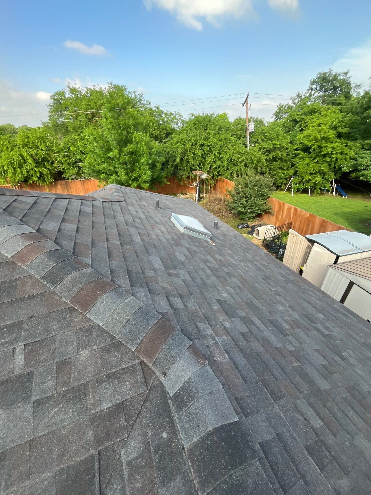 New Sky light/ New Roof/ Gutters and Fence Staining.  by Berry Good Roofing 