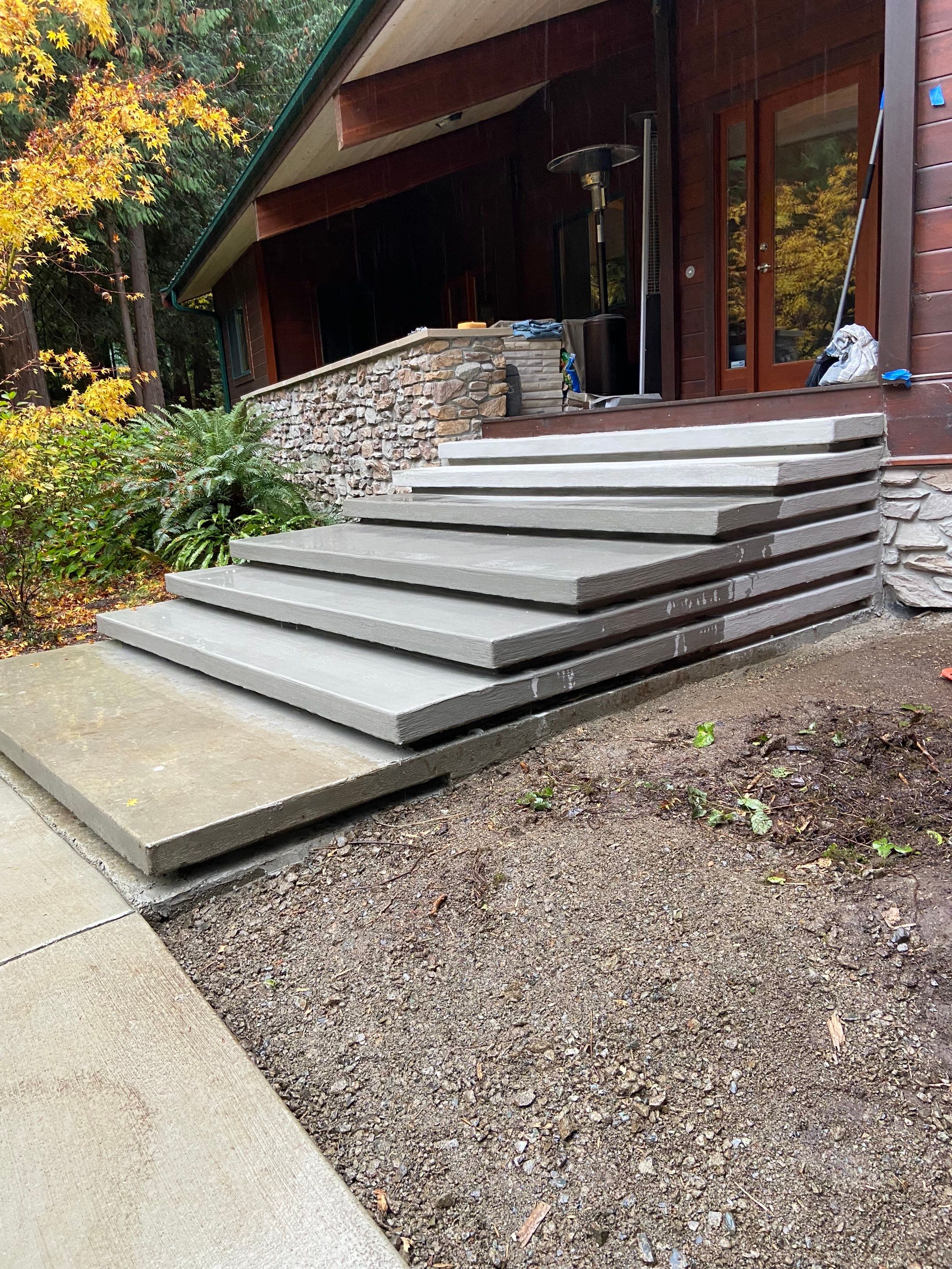 Pia | Custom Concrete Driveway, Walkway & Floating Steps by Jireh Asphalt & Concrete Inc 