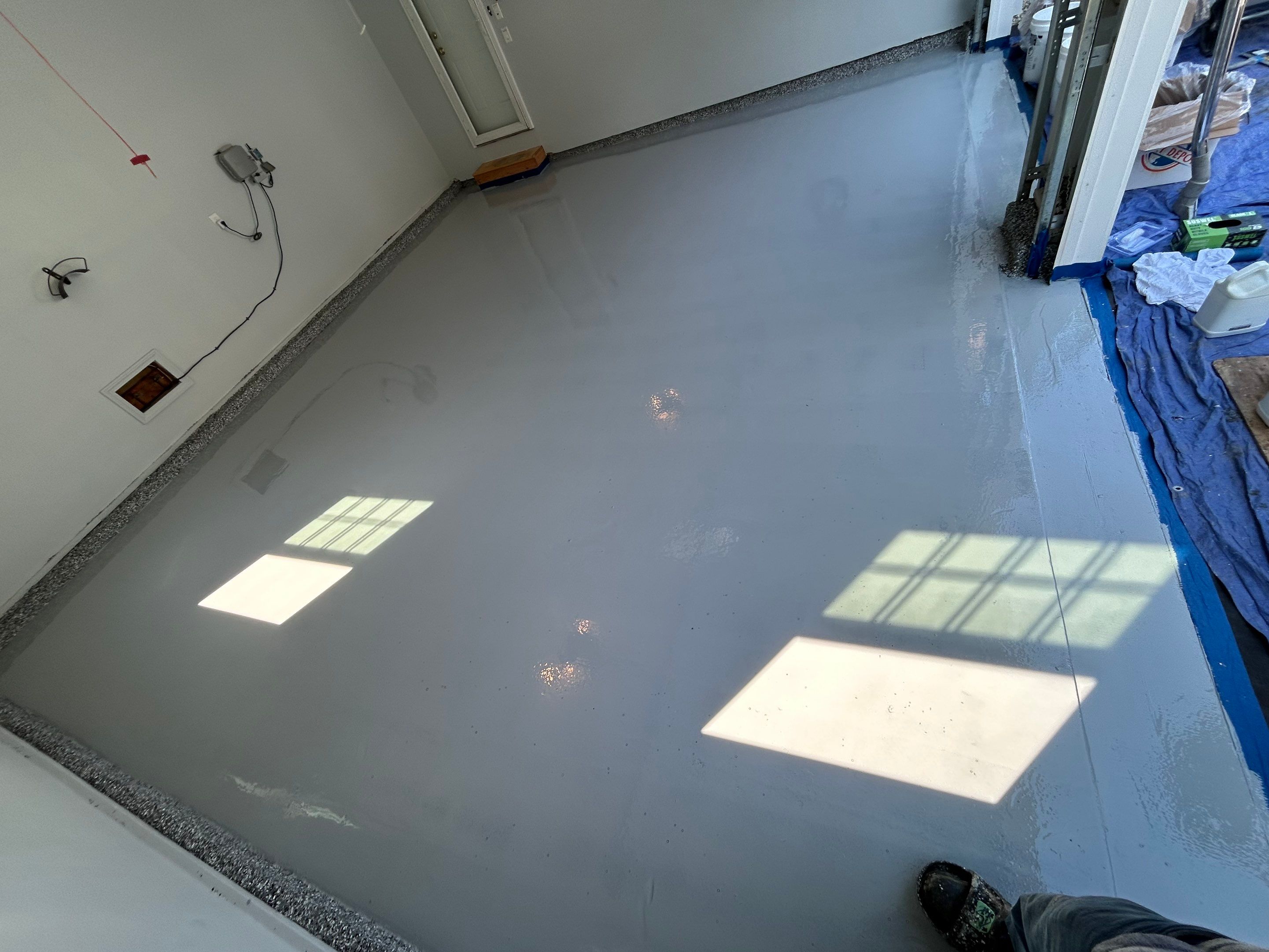 Wombat Concrete Floor Coating Transformation by DiGiorgi Roofing and Siding Inc
