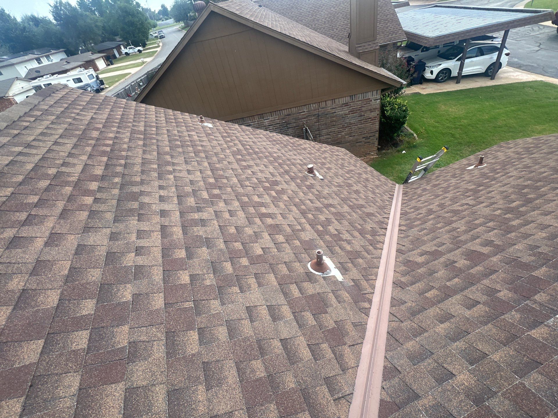 Hail Damage Roof Inspection in Oklahoma City, OK by McCann's Roofing and Construction