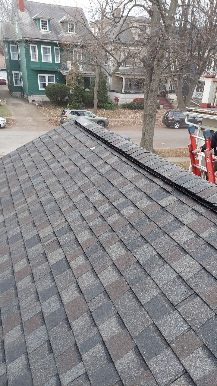 Exterior Renovations- Siding, Stamped Concrete, Porch, and Railings by Ivy Lea Construction