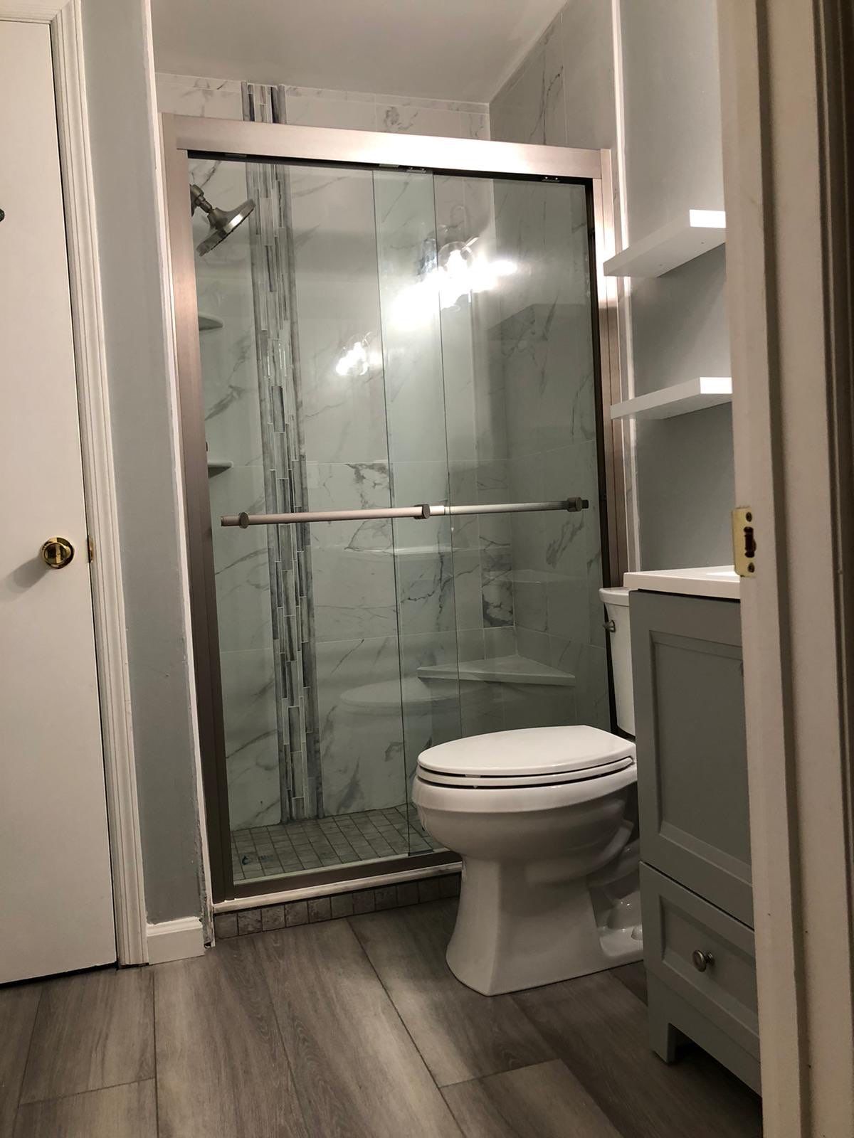 Bathroom Remodel using Tile by Home Concepts Construction