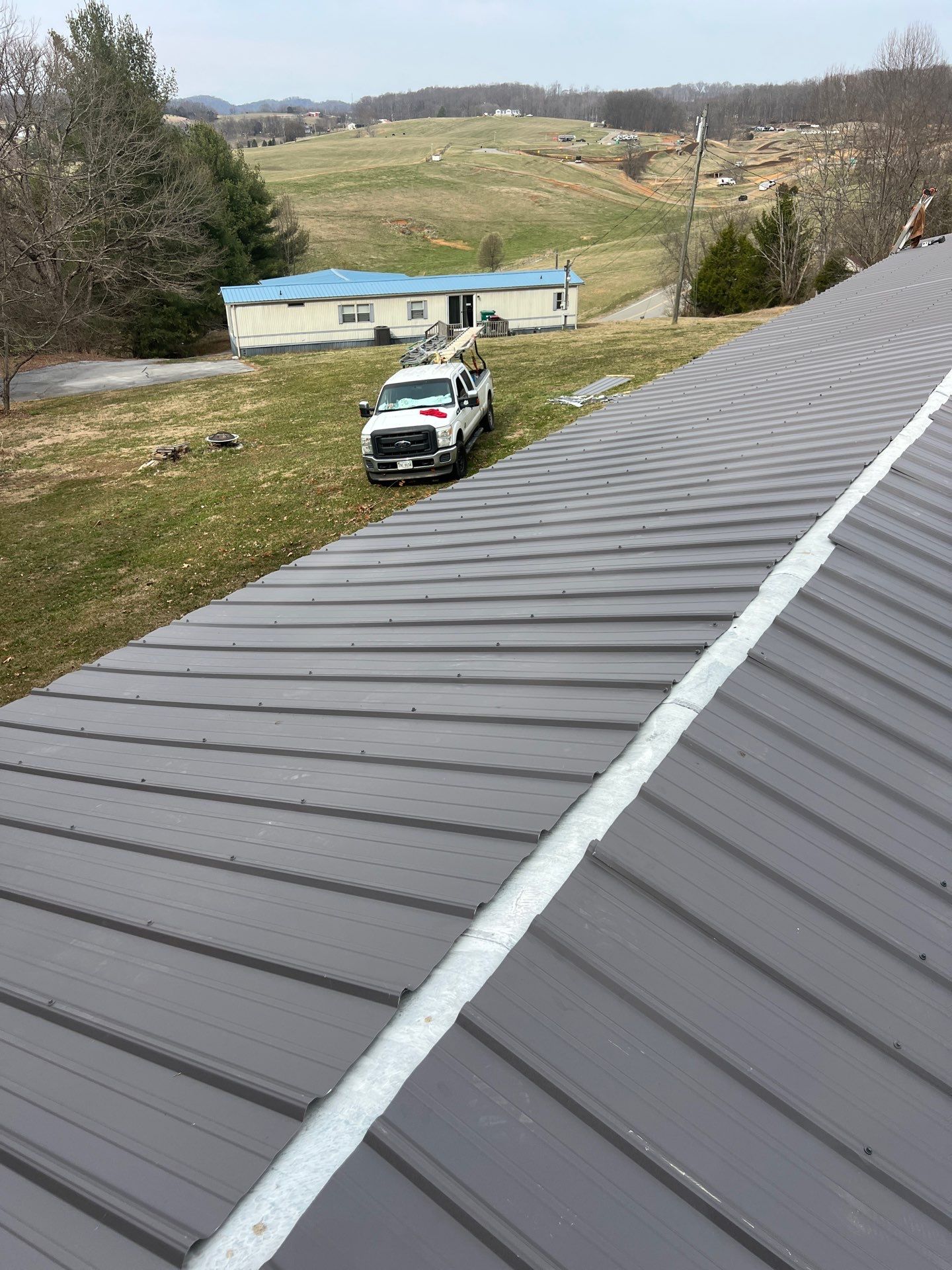 Textured Charcoal Gray using 29 Gauge AG Panel by Omnia Roofing