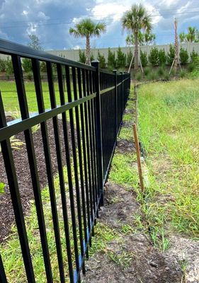 Aluminum Fence Installation using Black 3 Rail Aluminum Fence