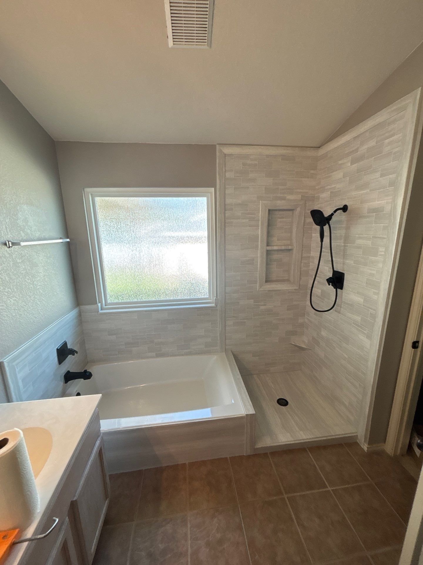 New walk in shower and tub in Kyle by Lane Lauritsen - The Hill Country, Texas