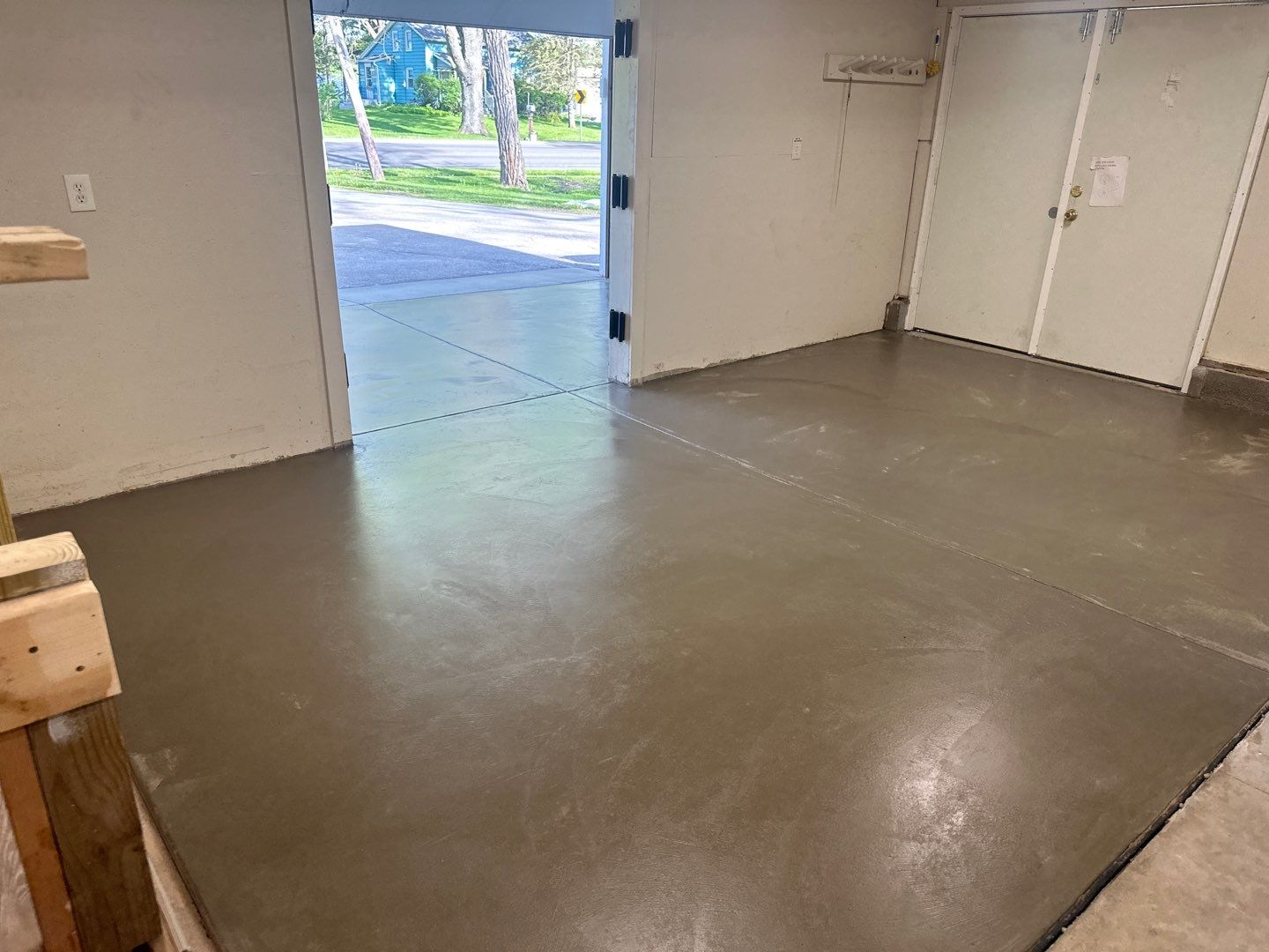 Concrete garage floor replacement with a broom finished apron  by NG Masonry & Construction LLC