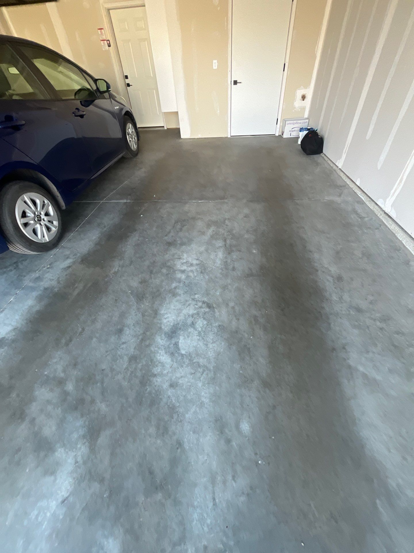 Custom Coyote Flake Garage Floor Coating in Sioux Falls by Select Painting, Coatings & Garage Cabinets