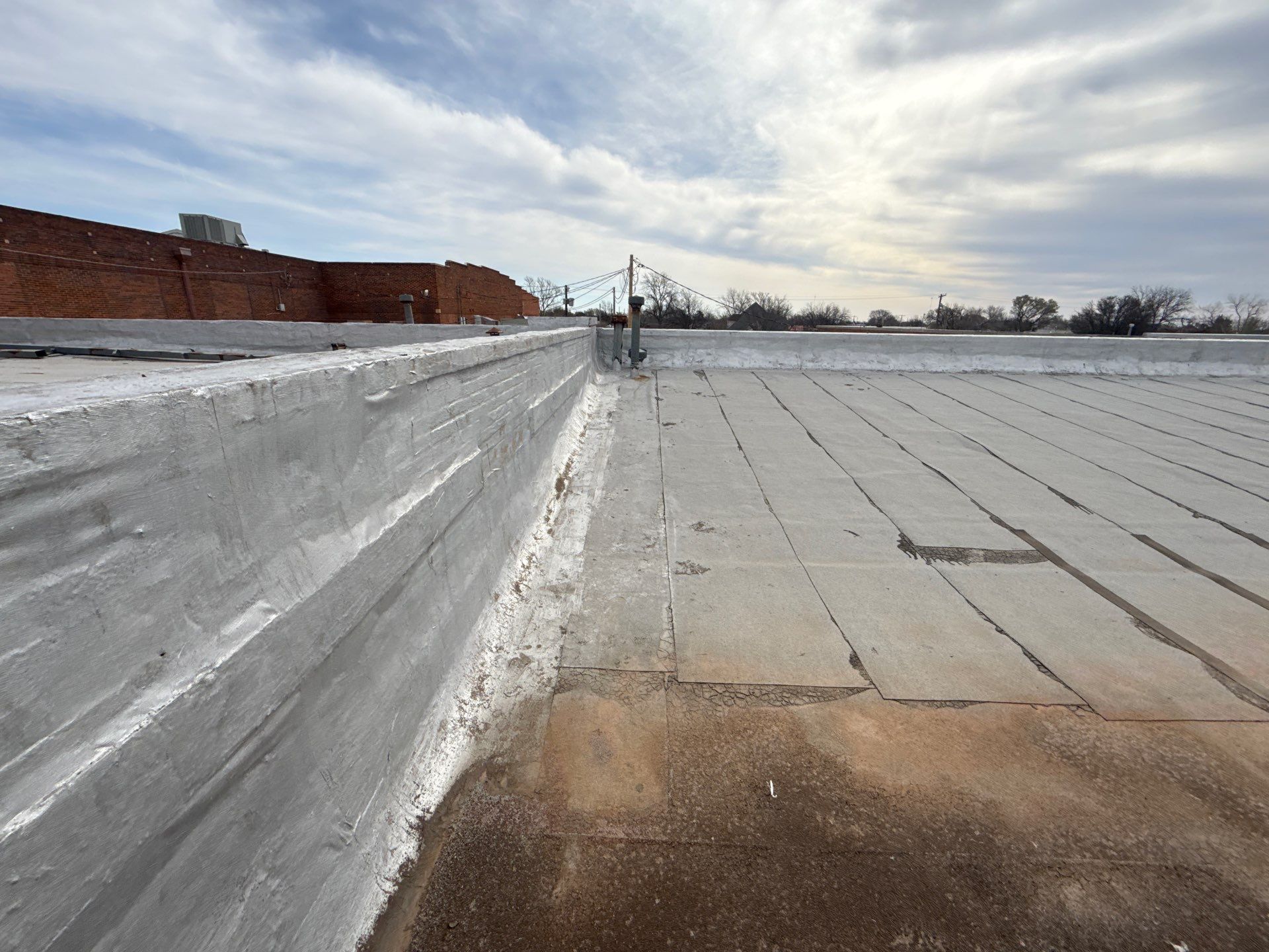 Hollis High School Comprehensive TPO Roof Replacement and Restoration by Secondary Rhodes