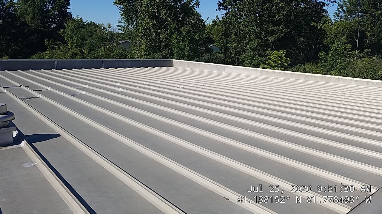 Commercial Metal Roof Coating by Gold Star Roofing LLC