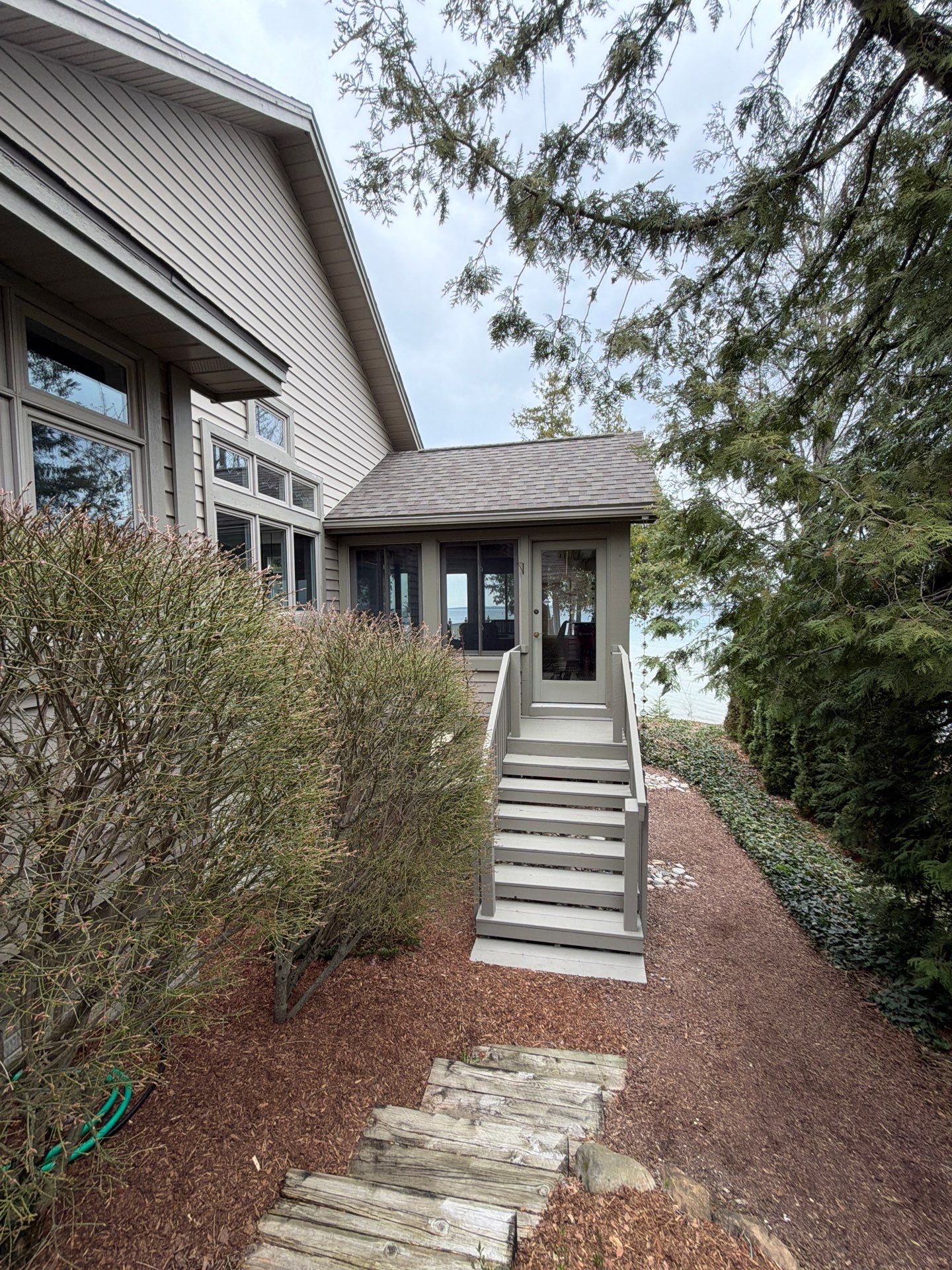 Custom Gutter Helmet Protection for Residential Roof in Suttons Bay by Rainbow Seamless Systems