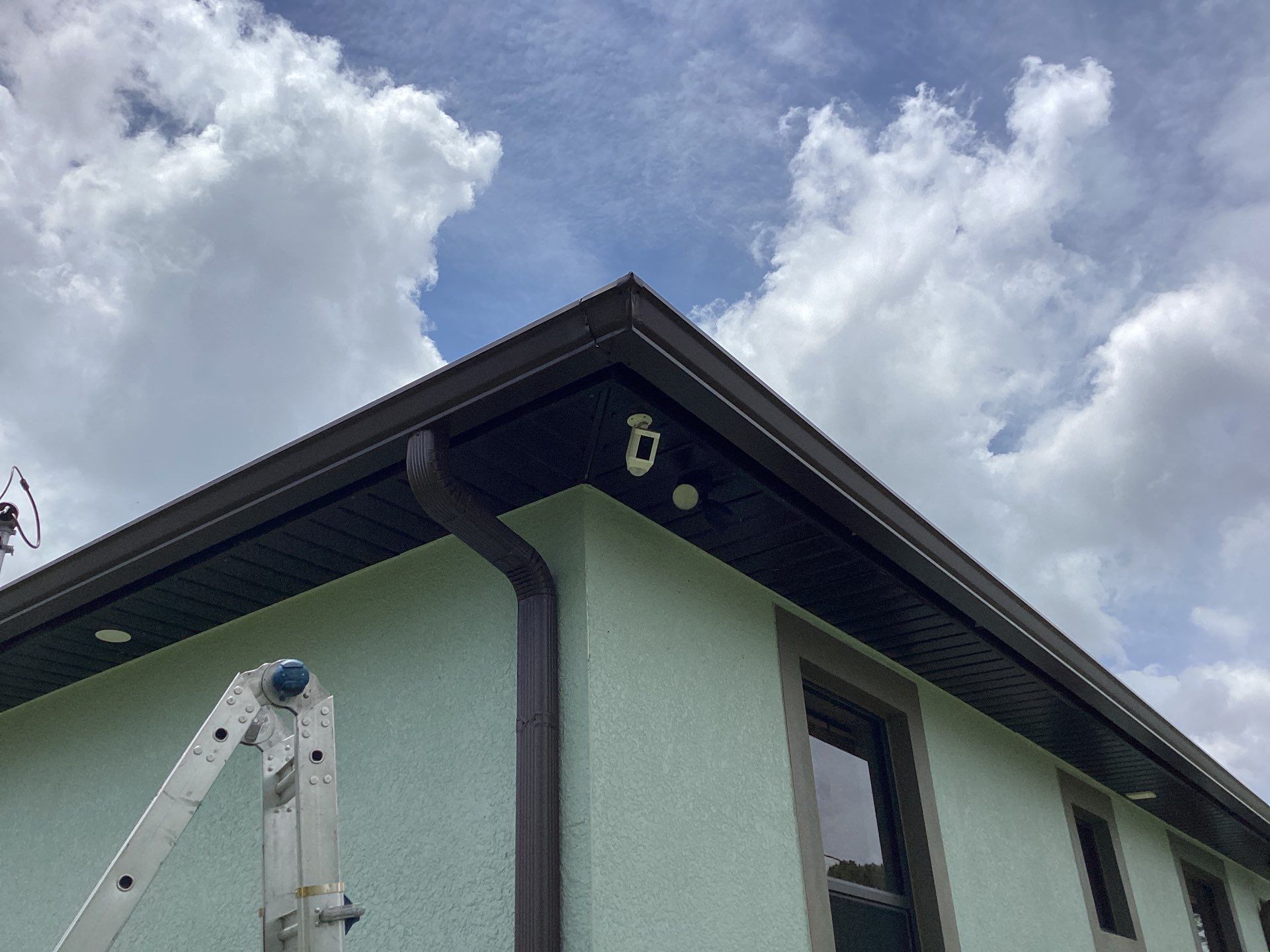 Musket Brown and New Downspouts in Lehigh Acres, FL  by Gutter Professors