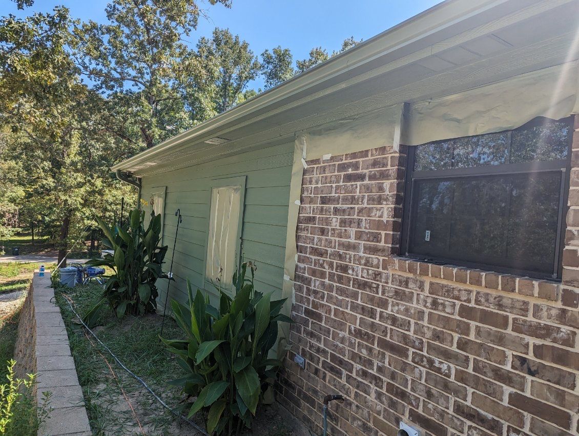 Exterior Repaint – Tyler, Texas - Bold green color with black garage by Quality Coats Painting