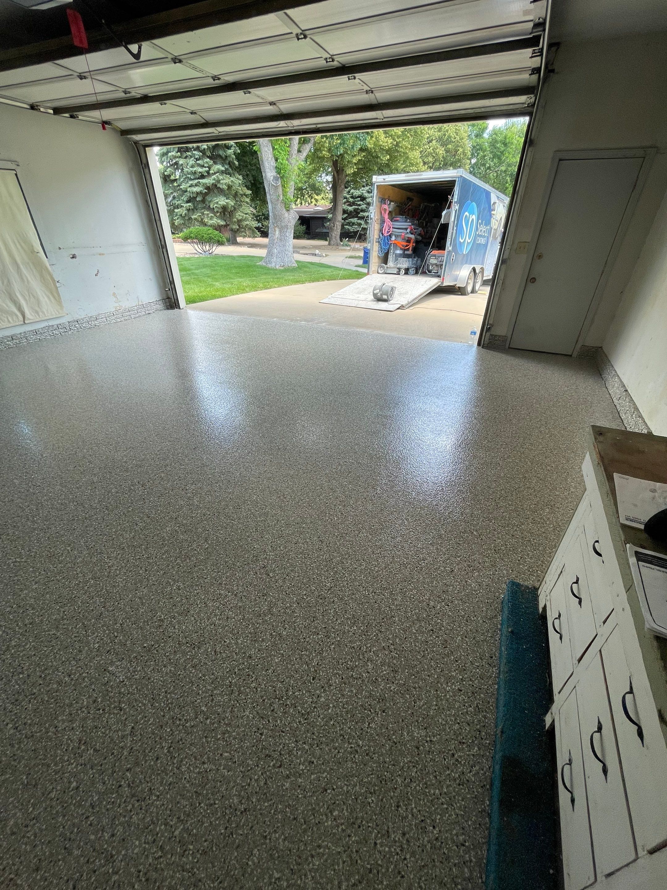 Custom Creekbed Garage Floor Coating in Sioux Falls by Select Painting, Coatings & Garage Cabinets