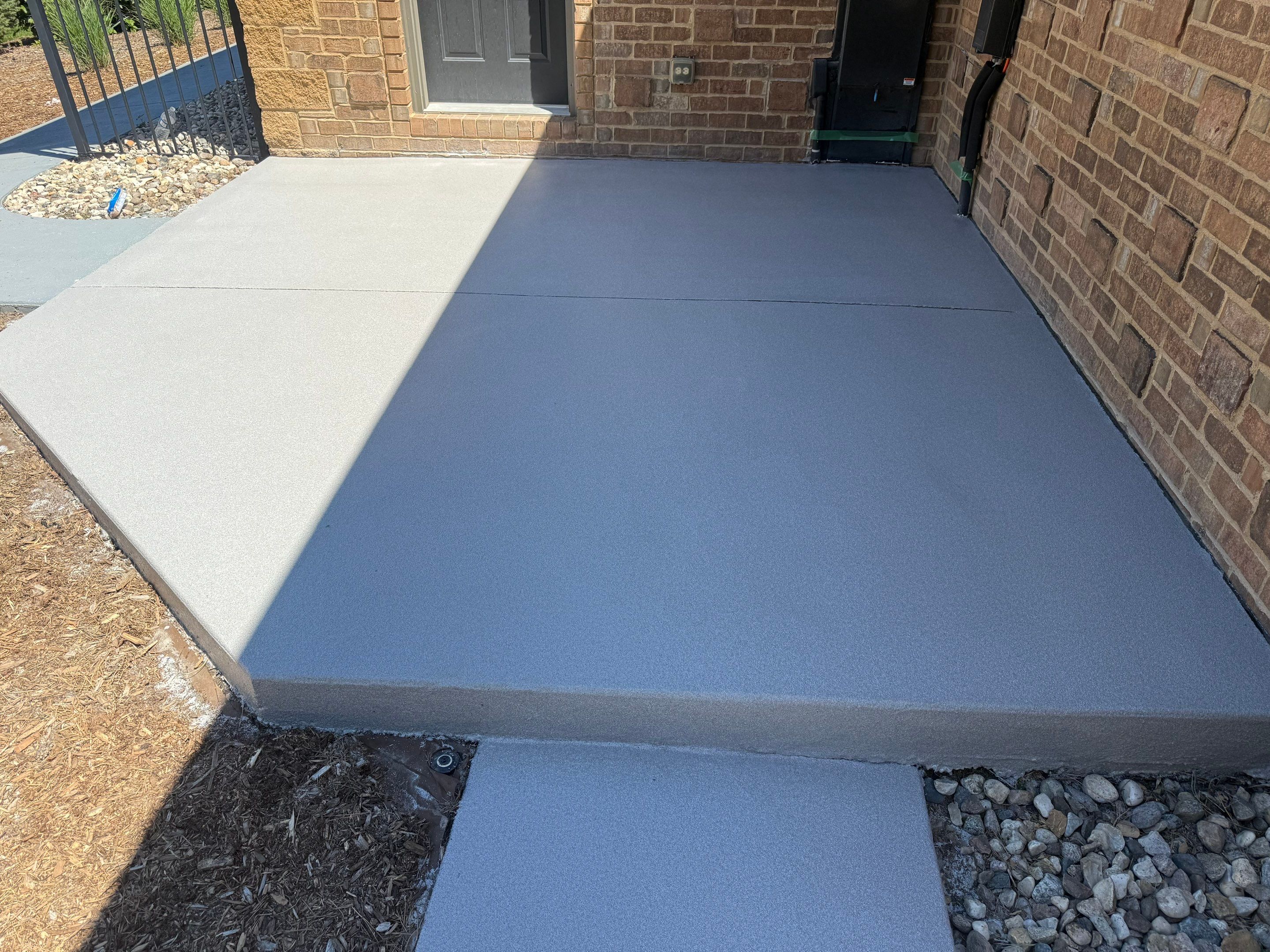 Decorative Concrete Pool Deck and Patio Resurfacing in Sioux Falls by Select Painting, Coatings & Garage Cabinets