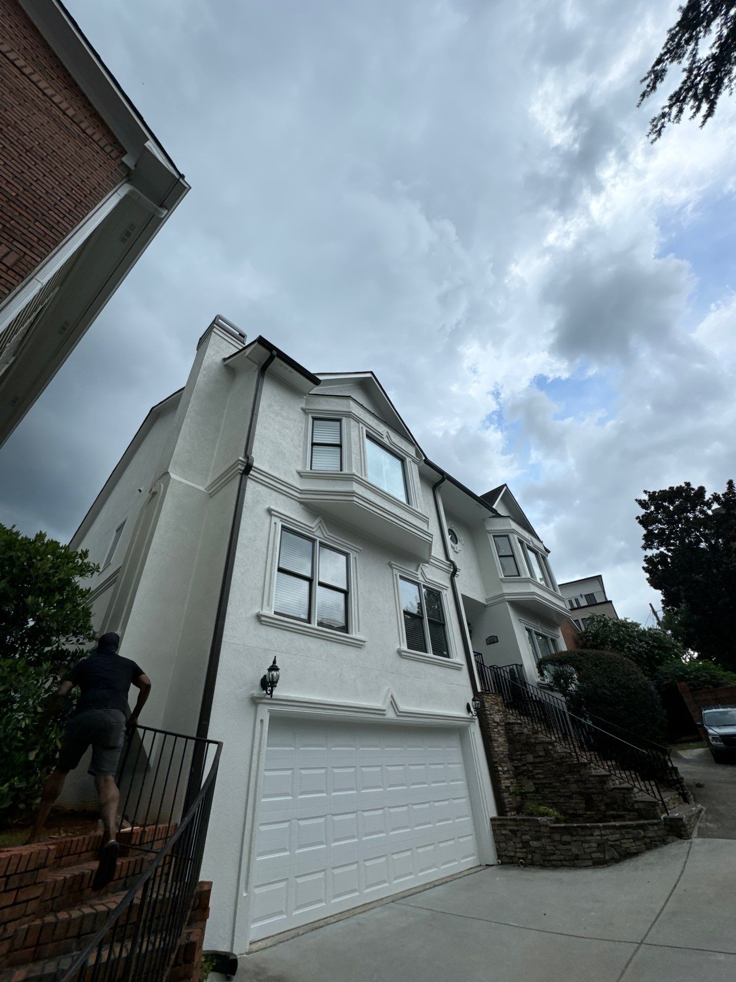 Full Exterior Stucco Painting and Wood Deck Staining in Atlanta by Swift Home Renovations
