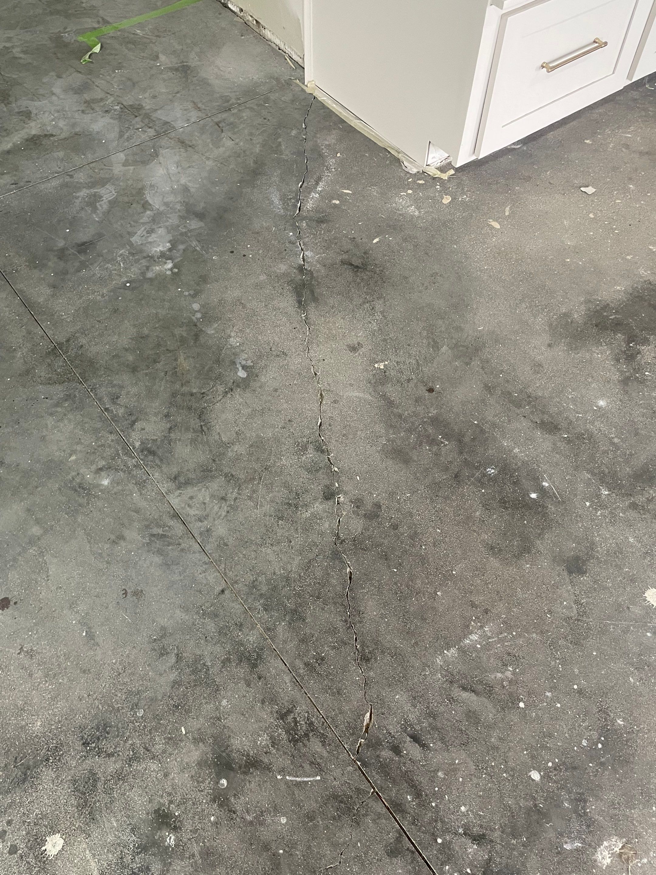 Cabin FEver Flake Garage Floor Coating Installation in Sioux Falls by Select Painting, Coatings & Garage Cabinets