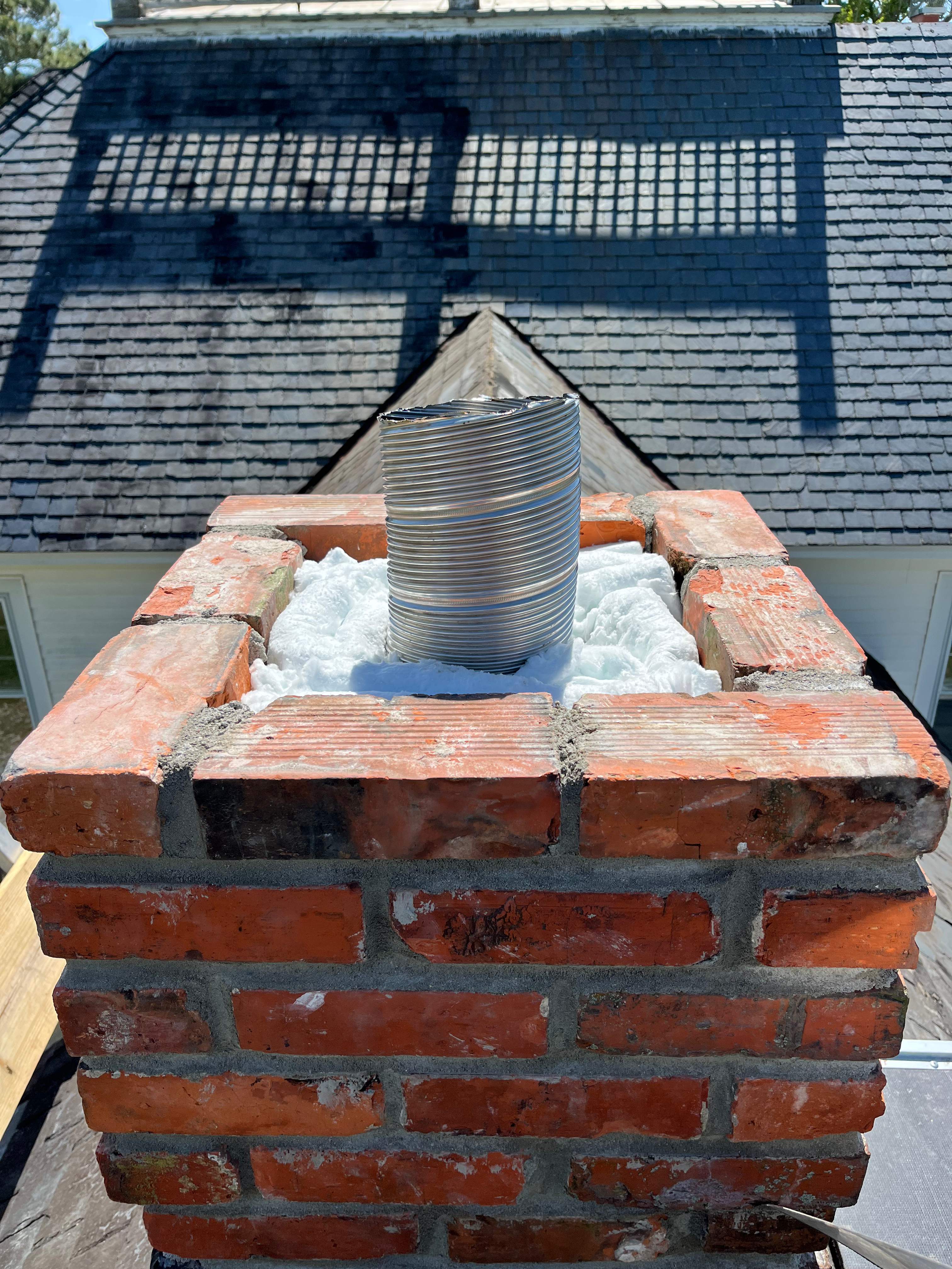 Wood Stove Installation and Fireplace Build by Premier Chimney and Roofing