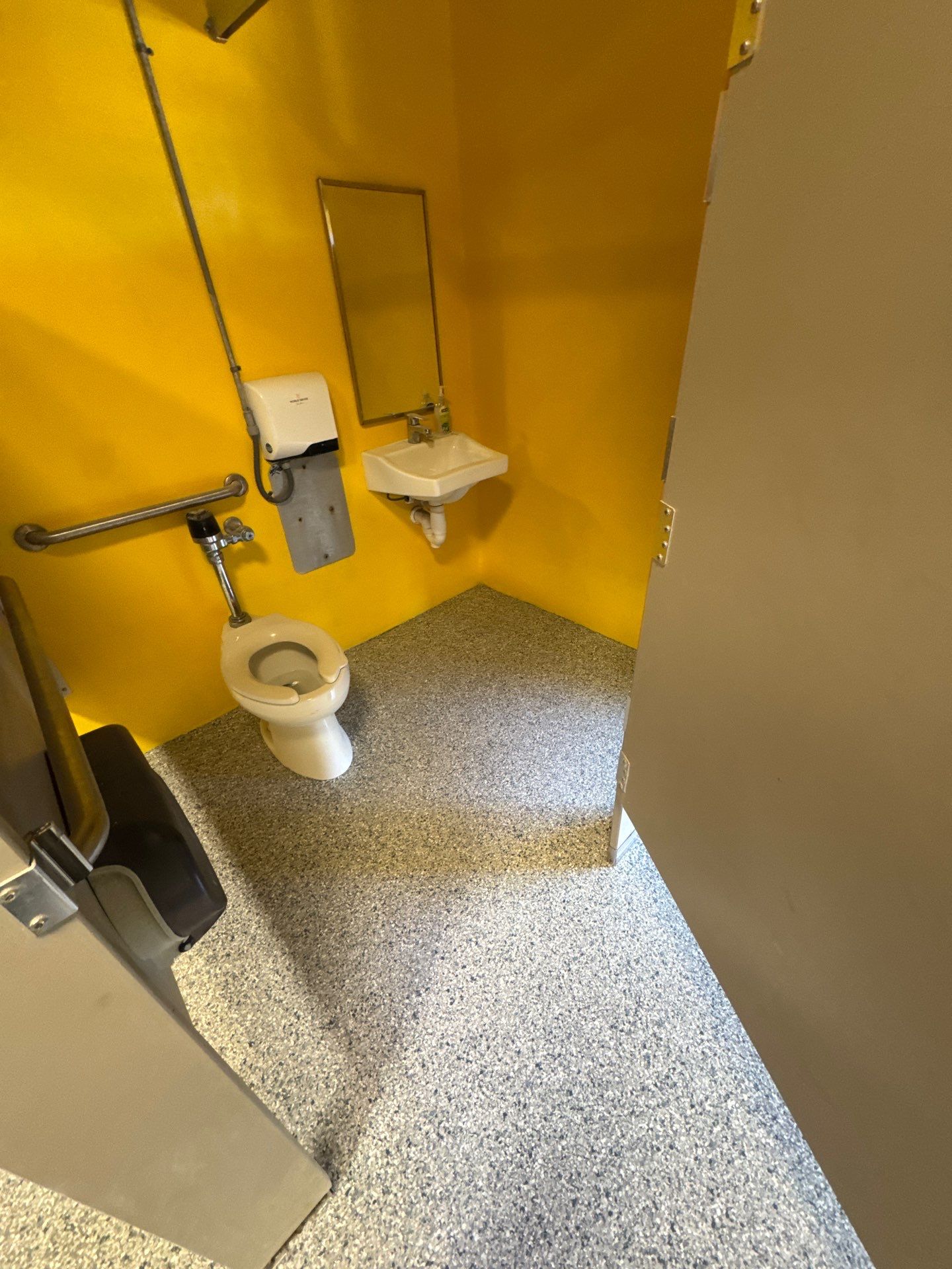Commercial Restroom Refresh: Seamless 'Tidal Wave' Flake for a Repeat Client by Performance Floors & Coating
