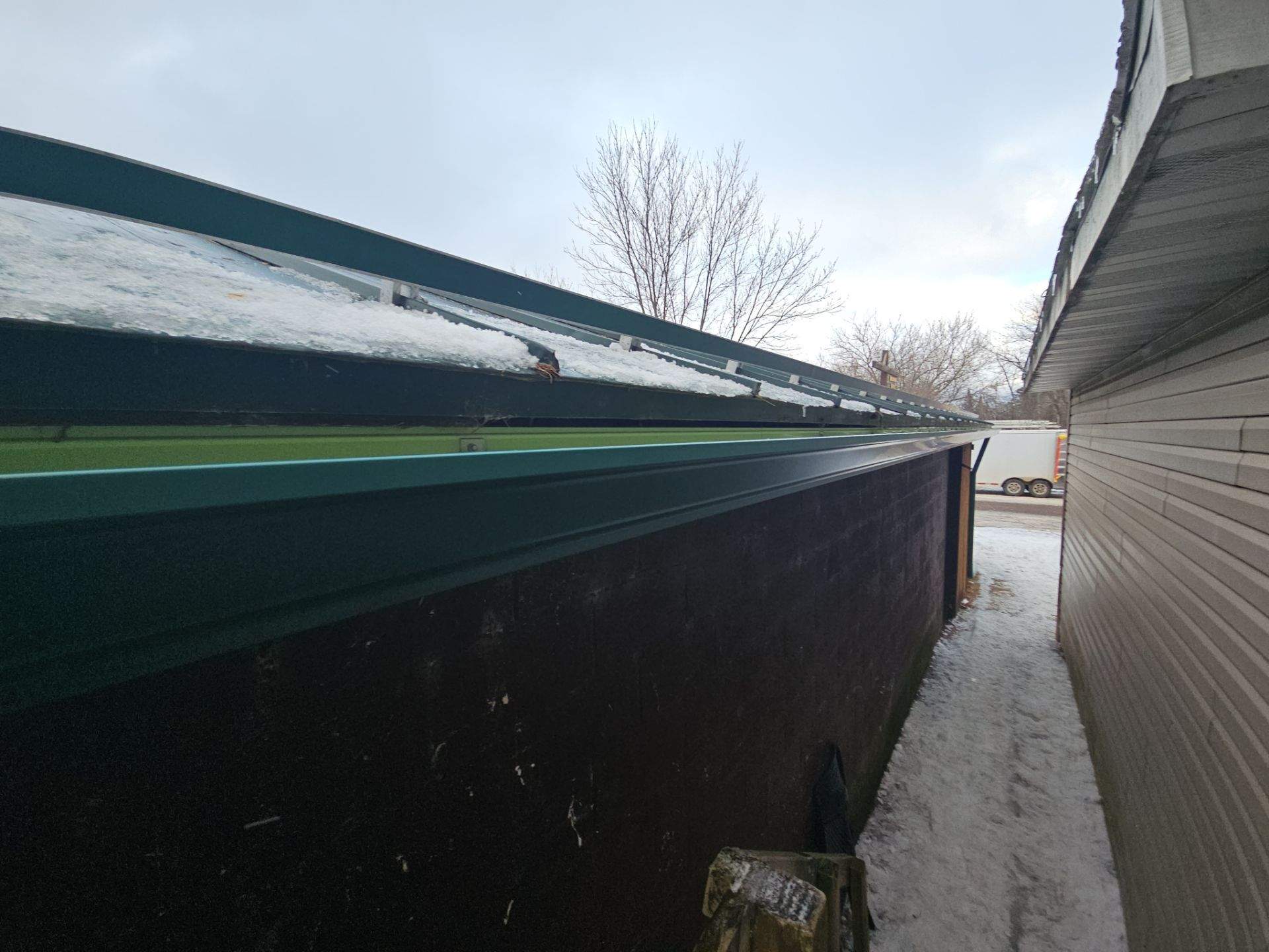 Commercial Gutter System Installation using 6" K-Style Seamless Aluminum Gutters and Snow Stops by AA Seamless LLC