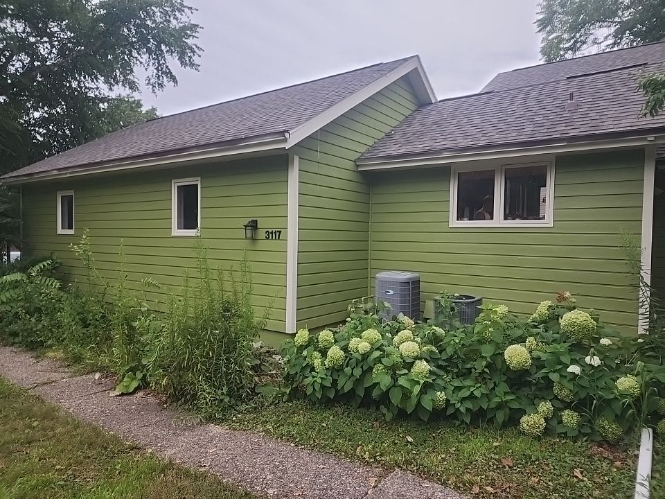 Complete house repaint to a different color  by Cutting edge painting 