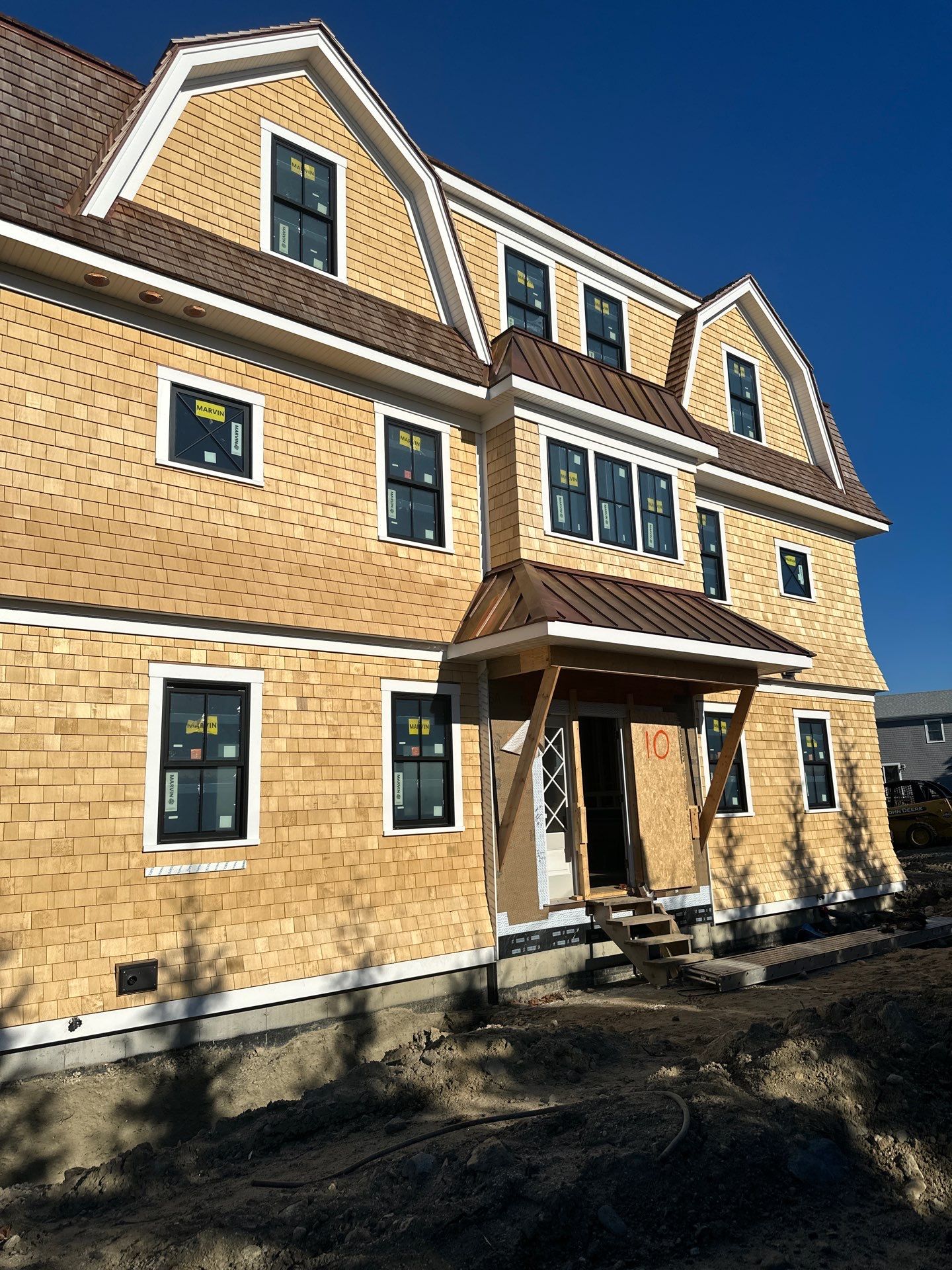 Great Island - Red Cedar Roofing, Yellow Cedar Siding, Standing Seam Copper, & Copper Gutters  by Rinaldi Brothers