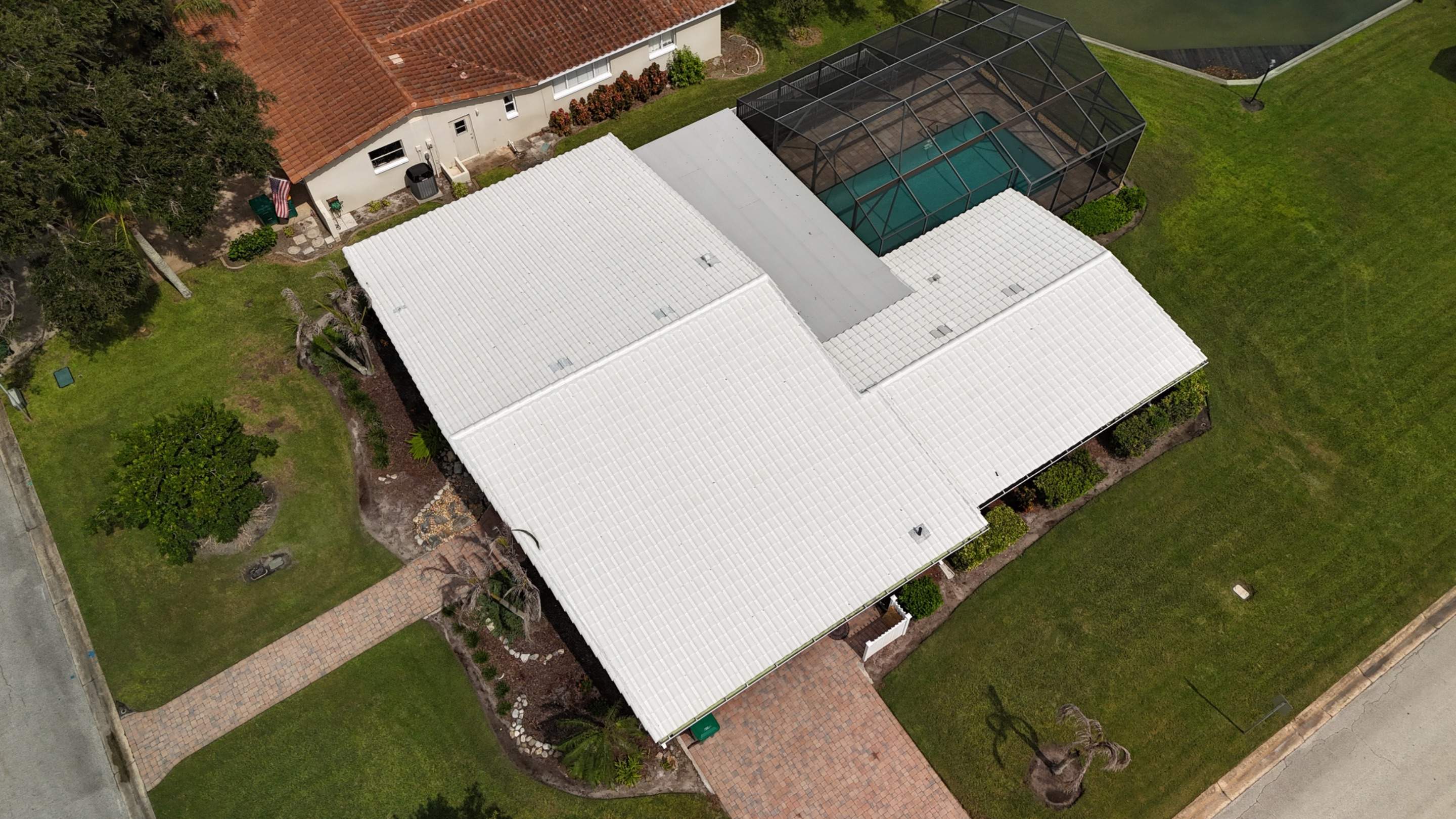 Comprehensive Concrete Tile and Flat Membrane Roof Replacement in Cocoa Beach by Wiedmann Construction & Roofing