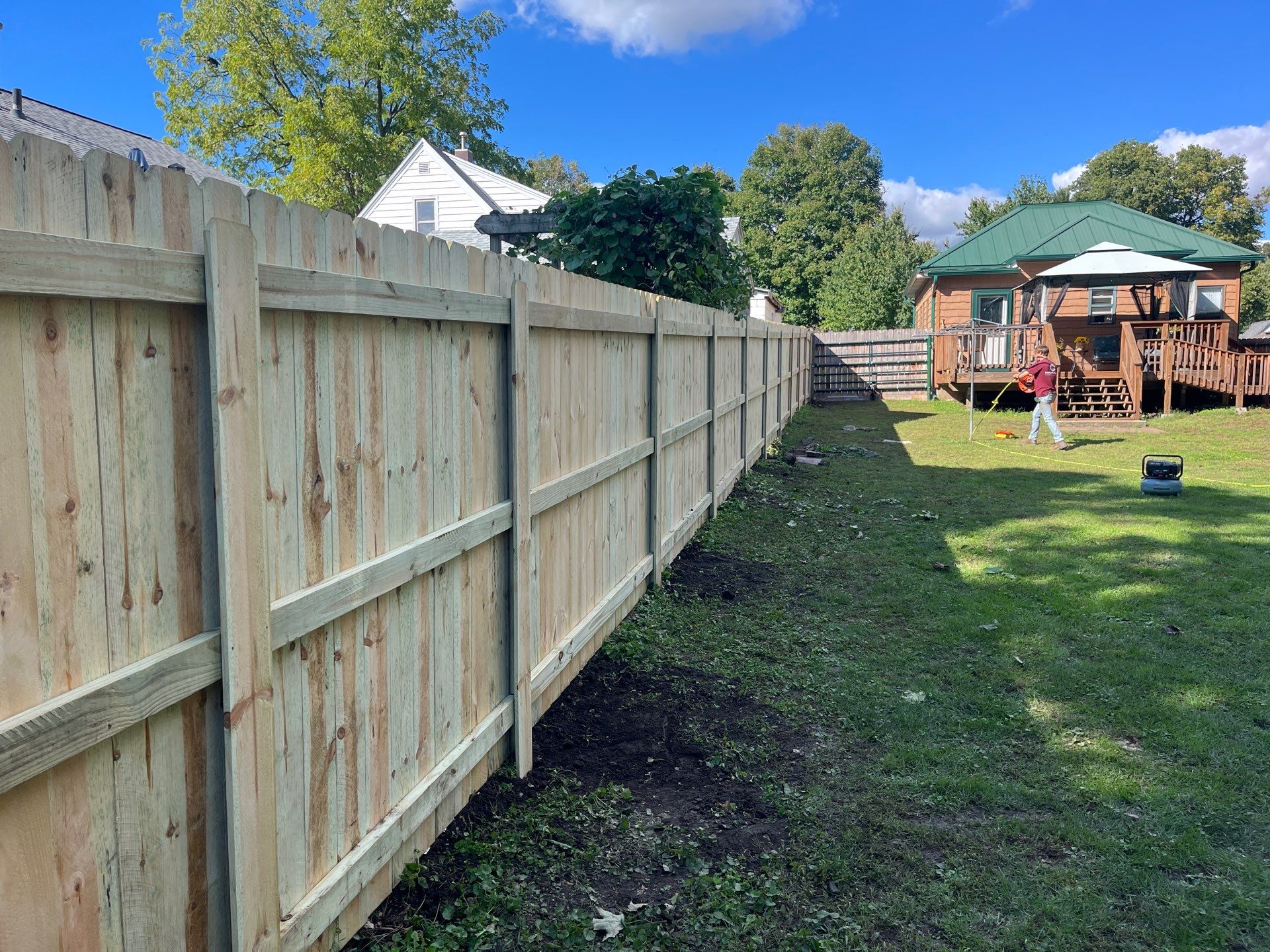 Pressure-Treated Wood Privacy Fence Installation in Waverly, Iowa by Perfect Picket Fence and Stain