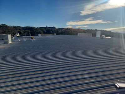 Wide view of a completed metal roof exterior