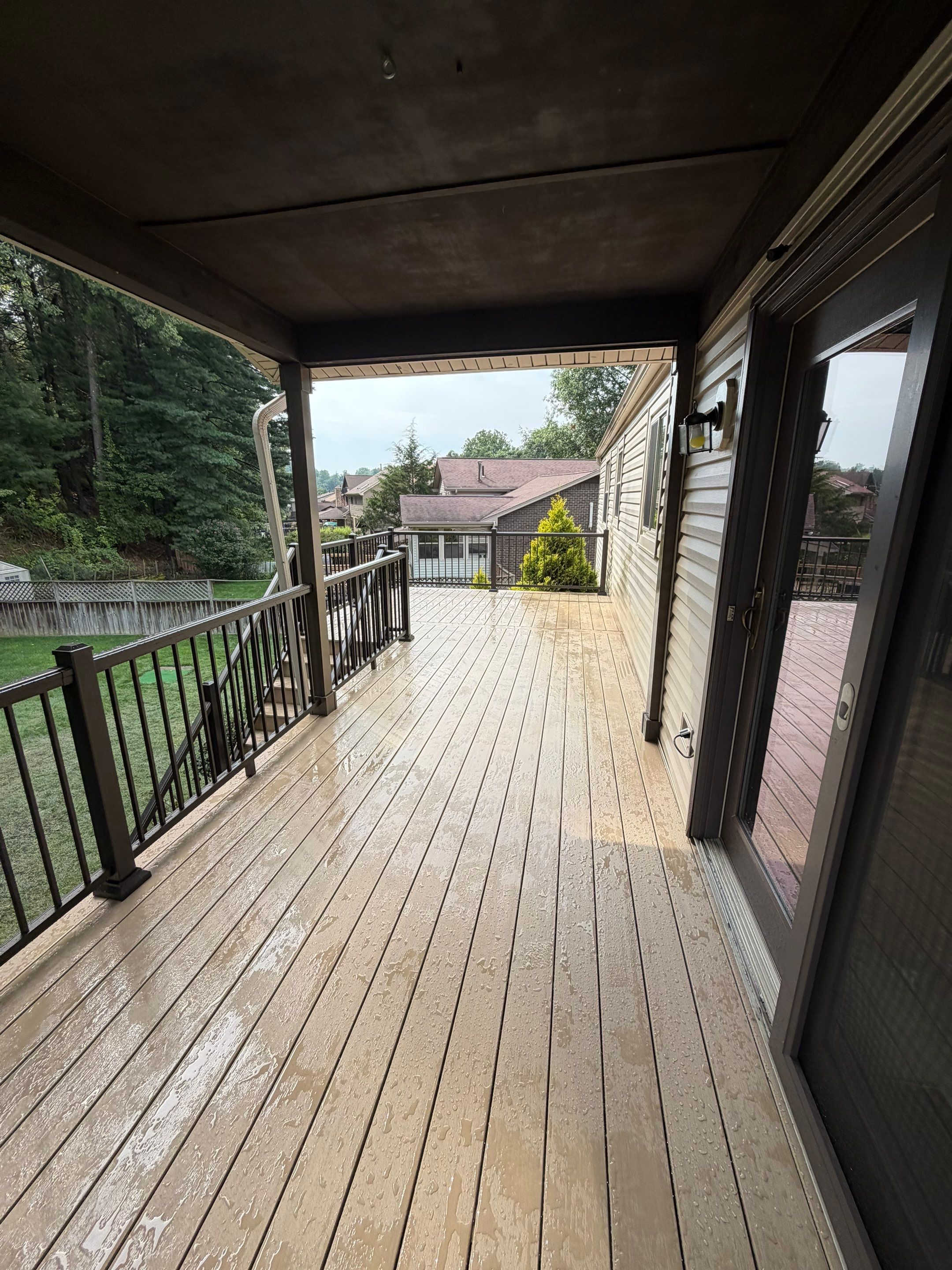 Elevated Composite Deck Installation with Covered Porch in South Park Township by Cousins Roofing Siding & Decks