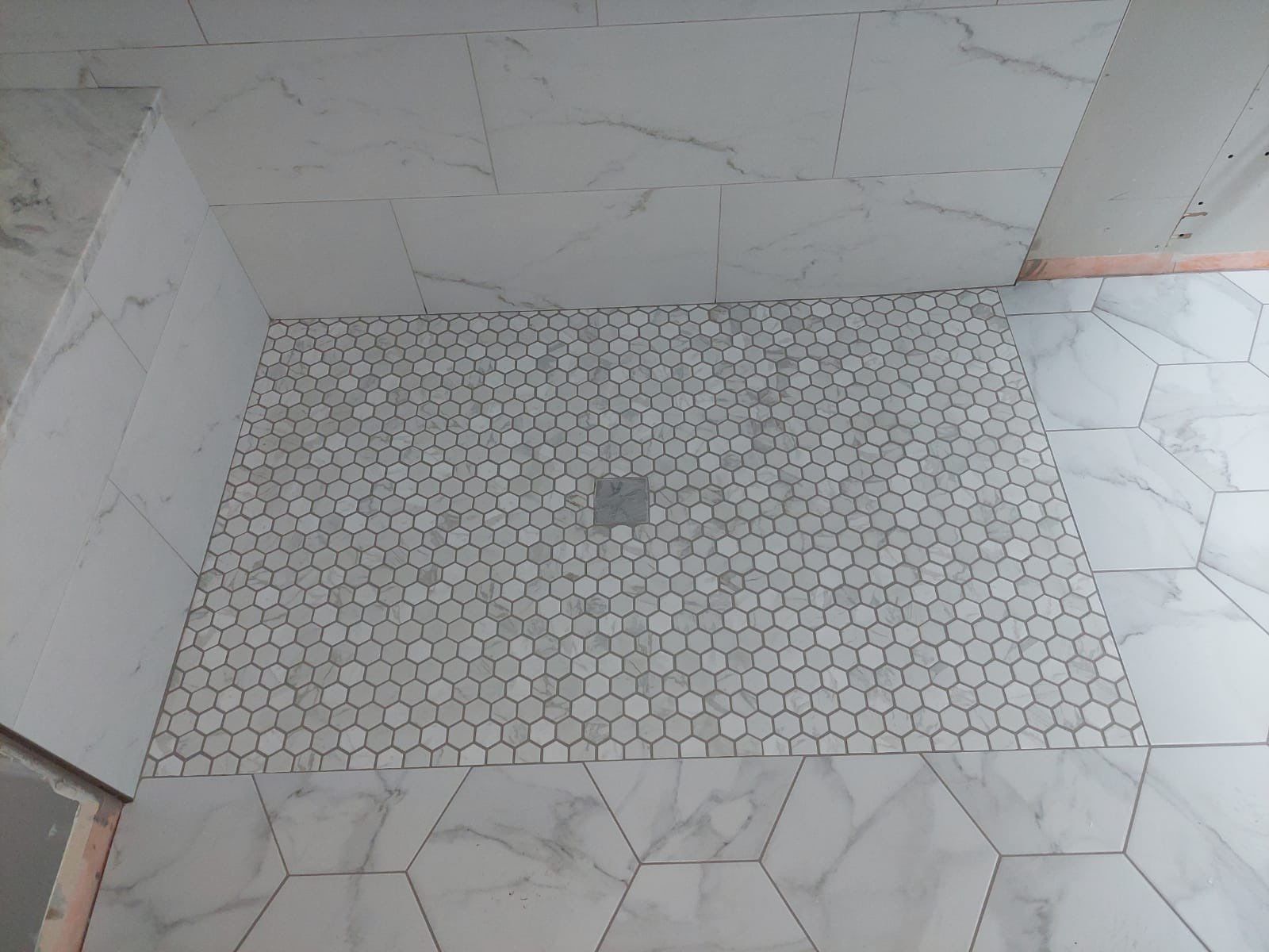Luxury Bathroom Remodel with Marble Tiles in Kennesaw by Swift Home Renovations 