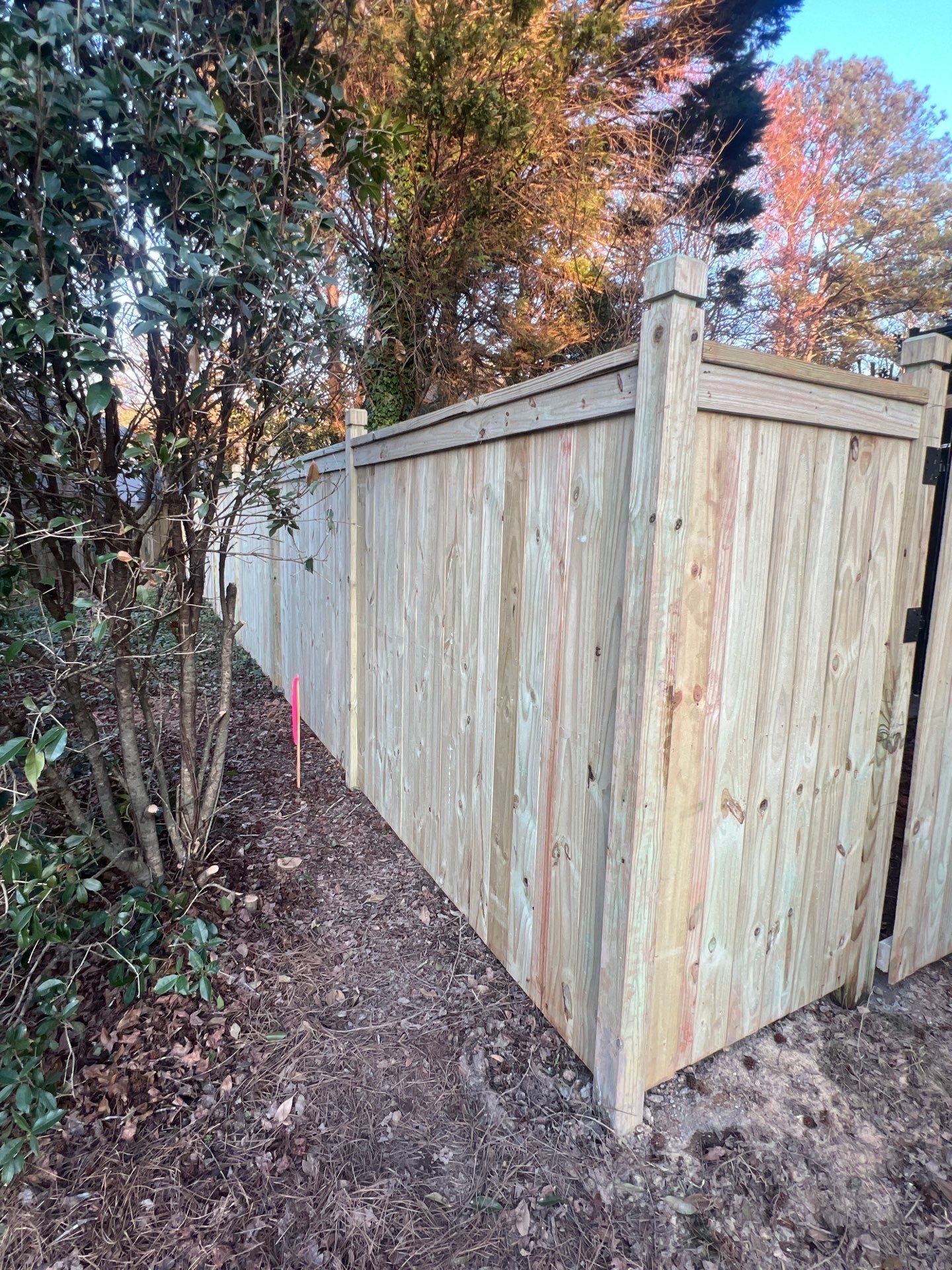 Pressure-Treated Wood Fence Installation and Deck Staining in Atlanta by Swift Home Renovations