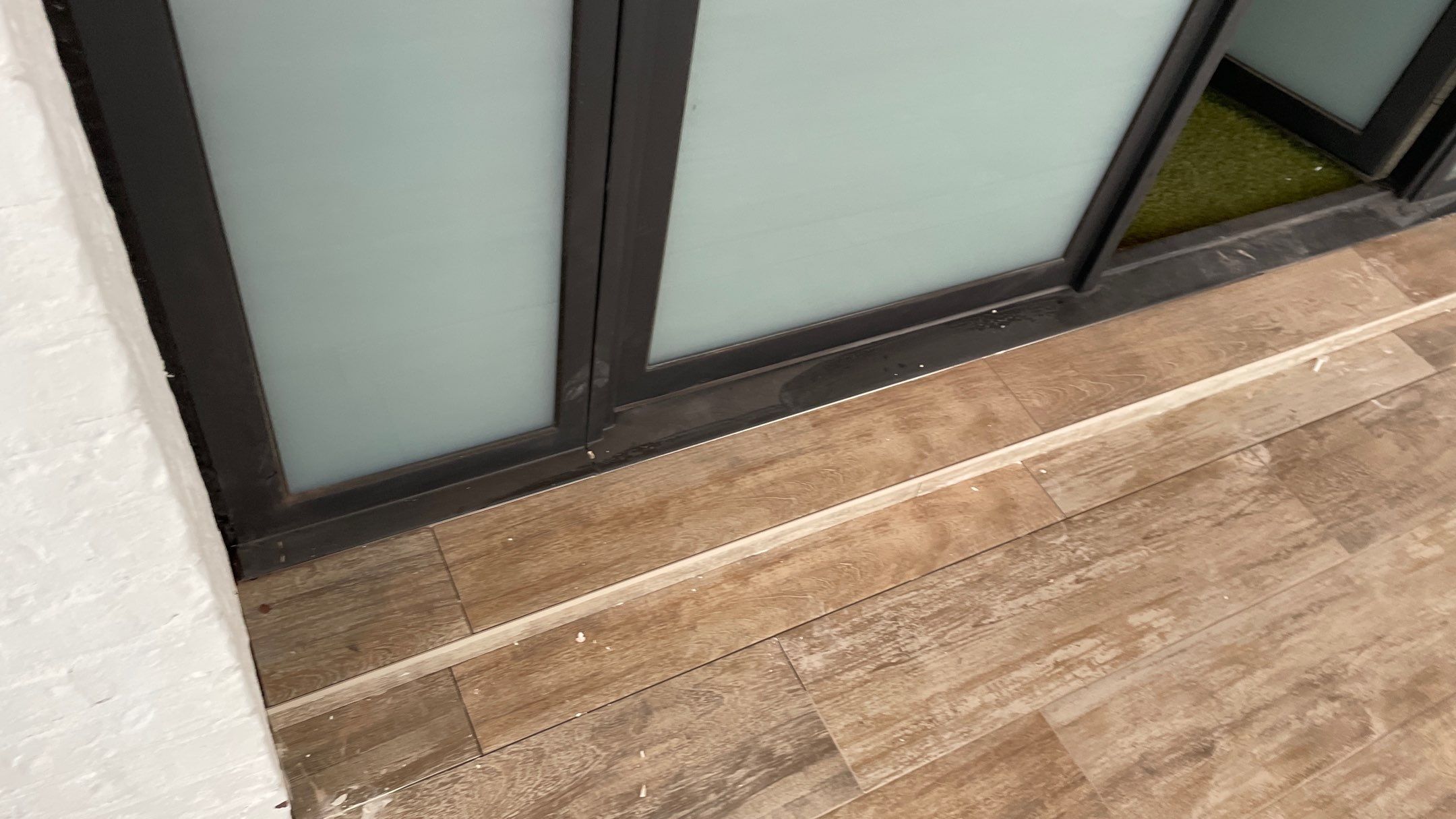 Instant Transformation of this Beautiful Sunroom by Footprints Floors of Coastal Carolina