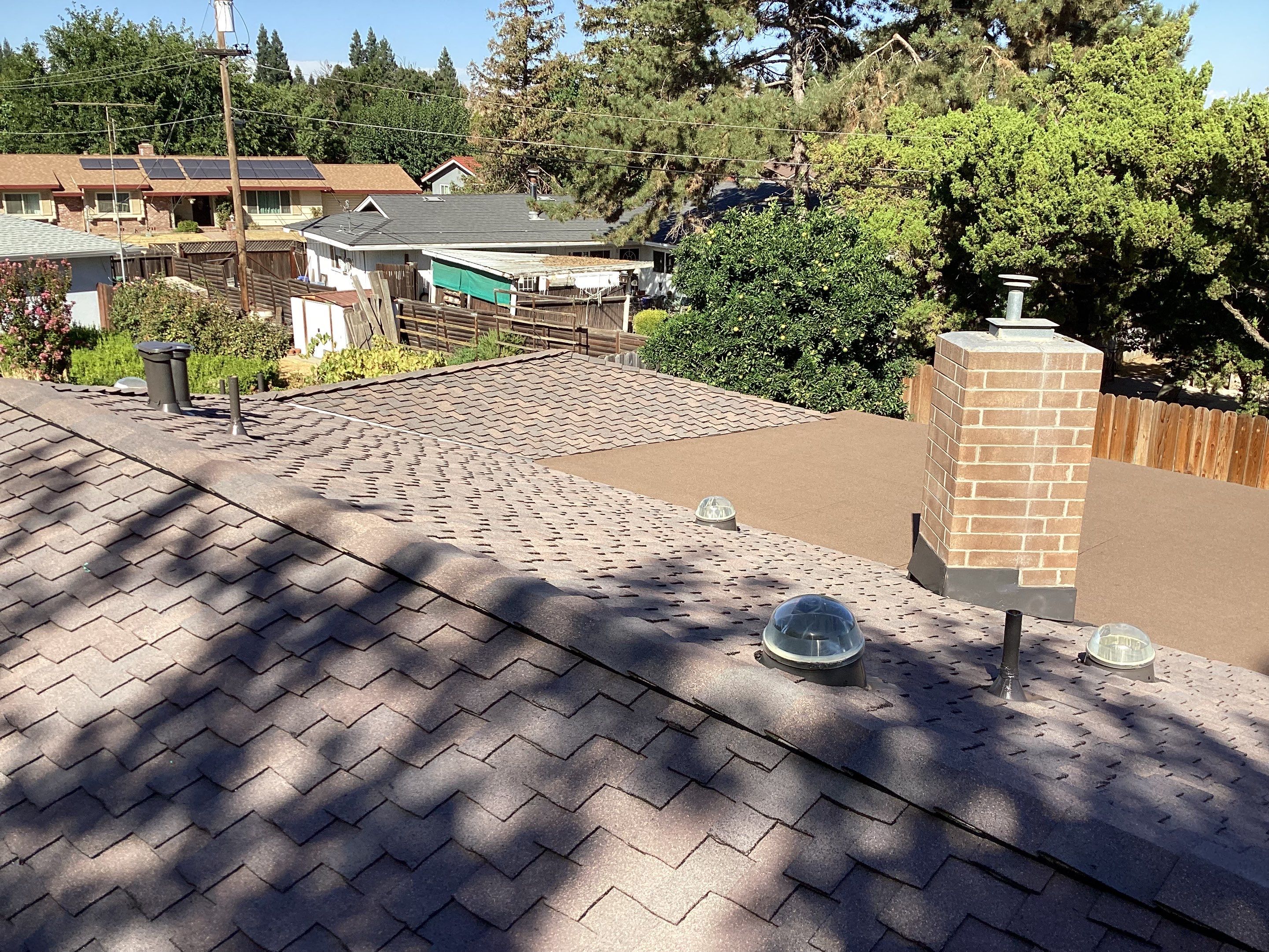 Installation of Certainteed Presidential shingles on residential house by Straight Edge Roofing Inc
