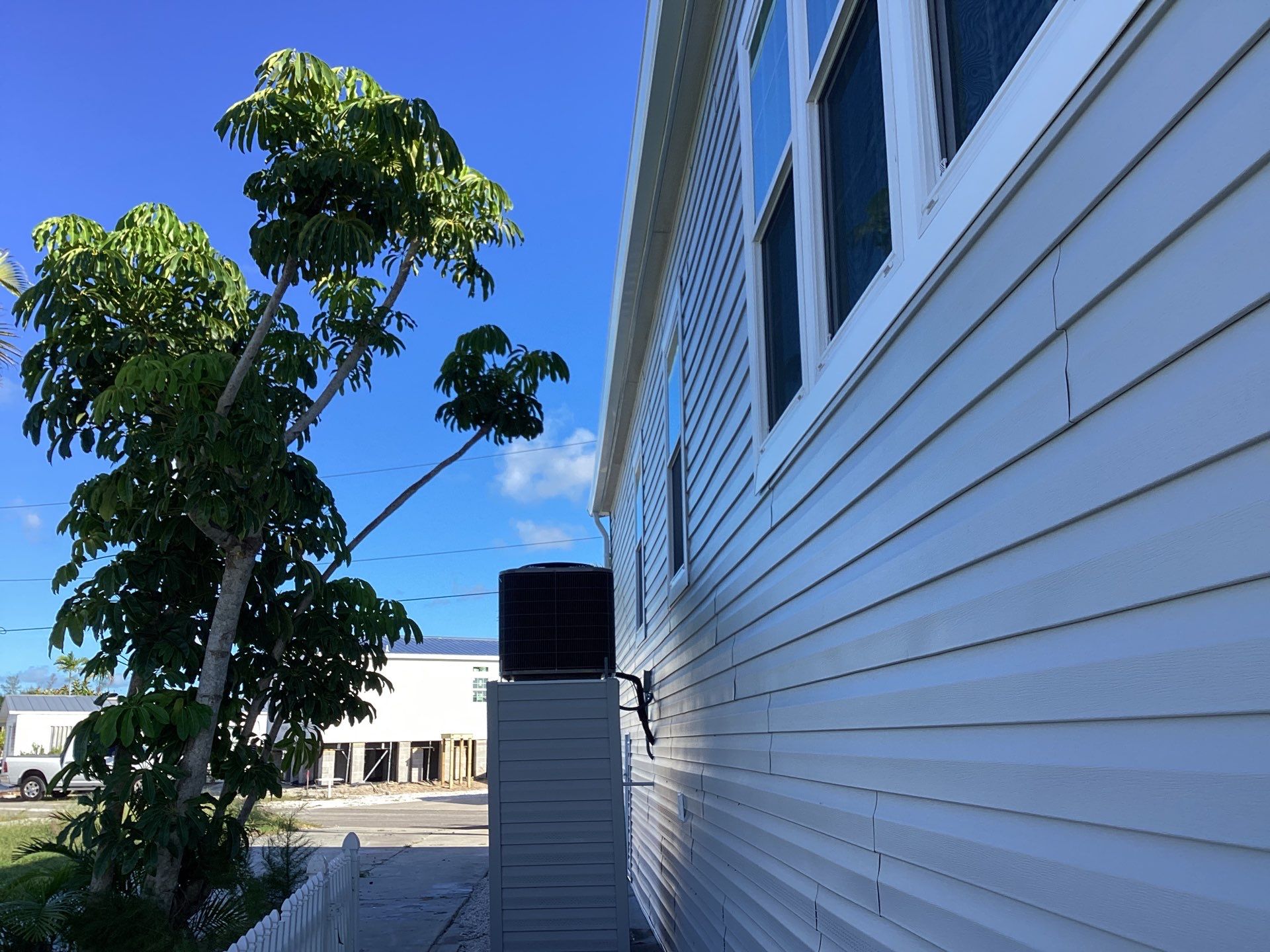 White Downspouts Installation in St. James City by Gutter Professors