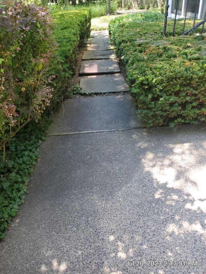 Aggregate concrete cleaning and sealing using Surebond SB-9000 by Northern Power Washing LLC.