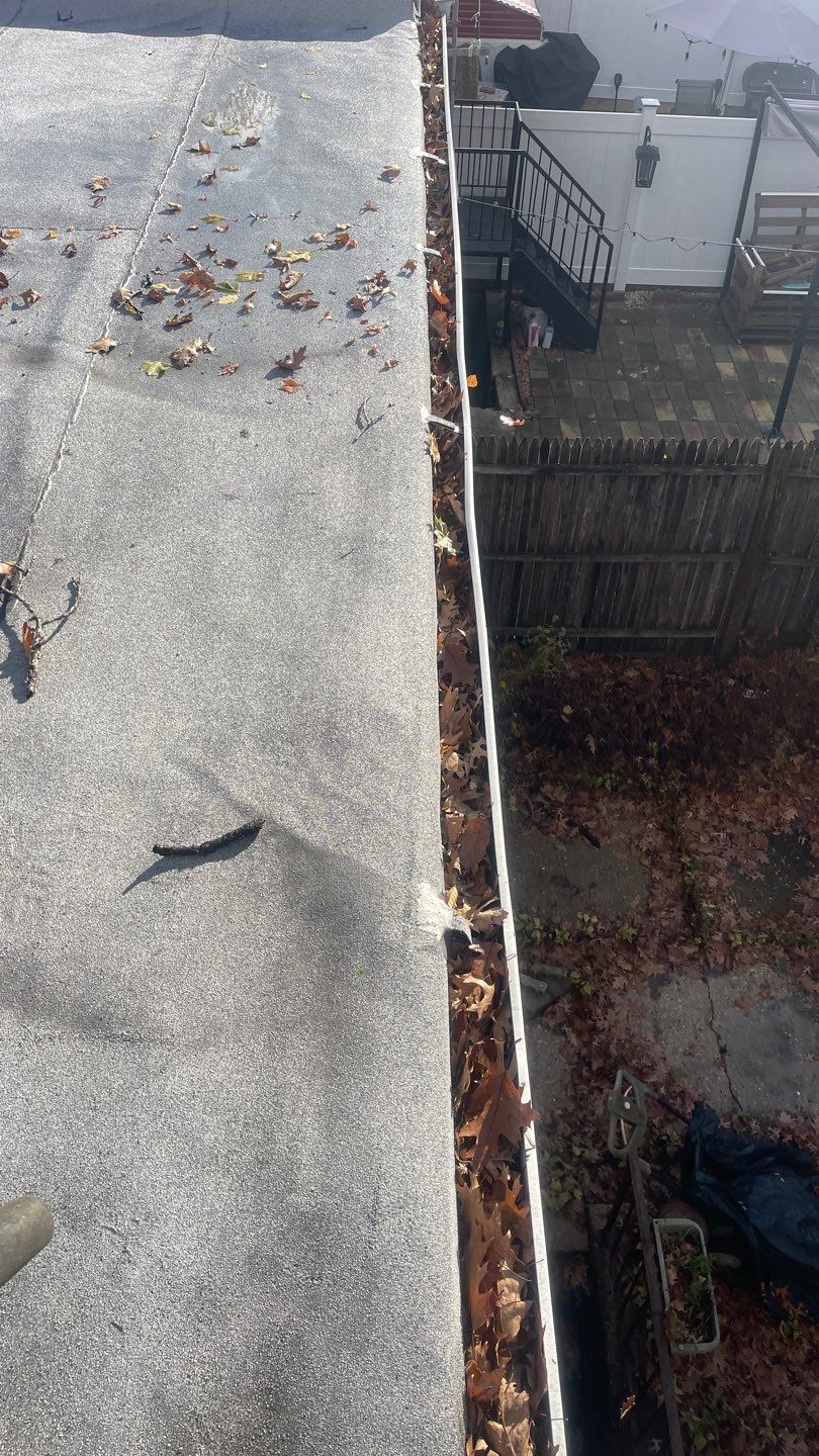 Flat Roof Cleanup and gutter cleaning.  by Above All Gutters 