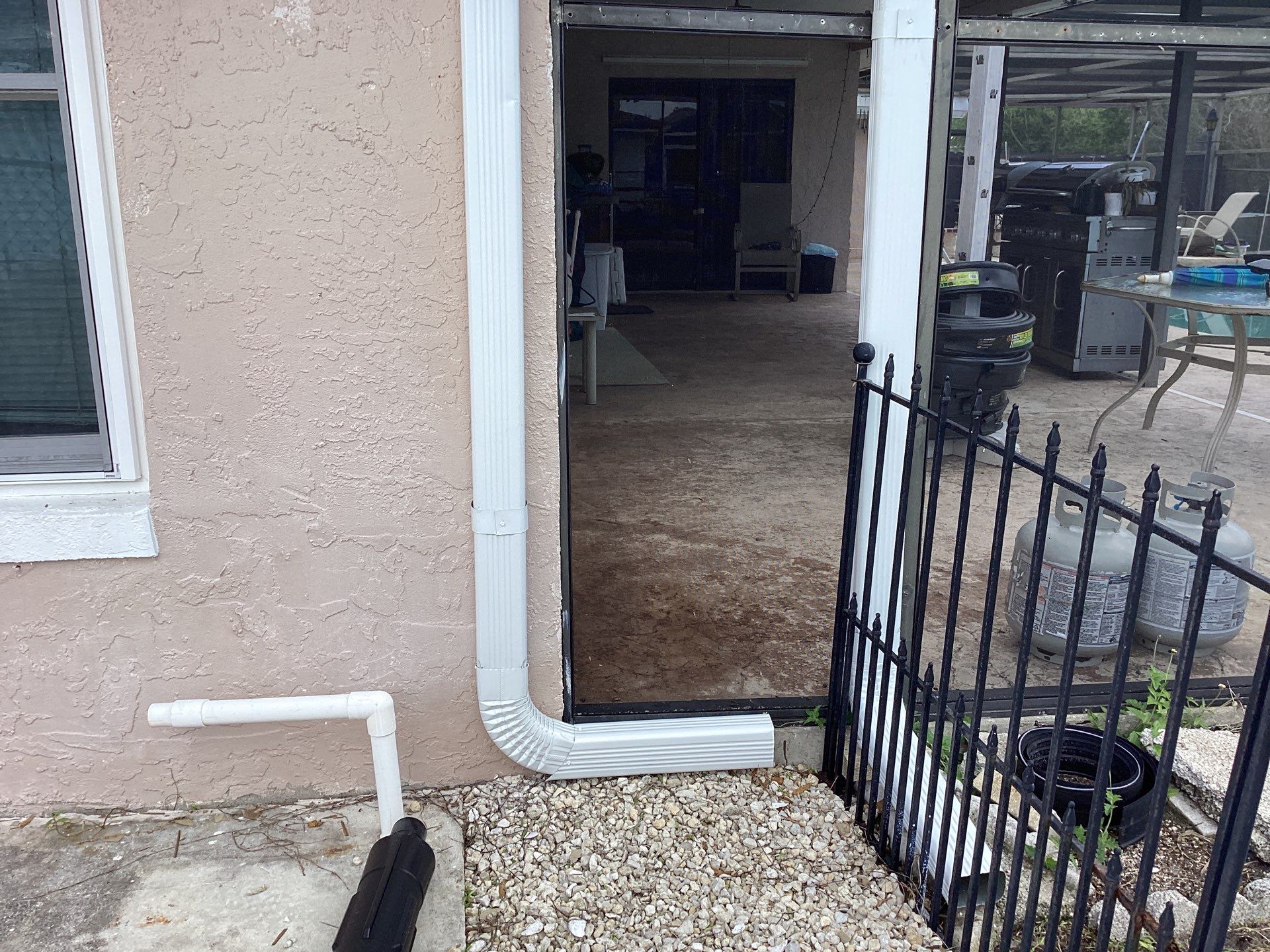 White Seamless Gutters and Splash Guards in Fort Myers FL by Gutter Professor by Gutter Professors