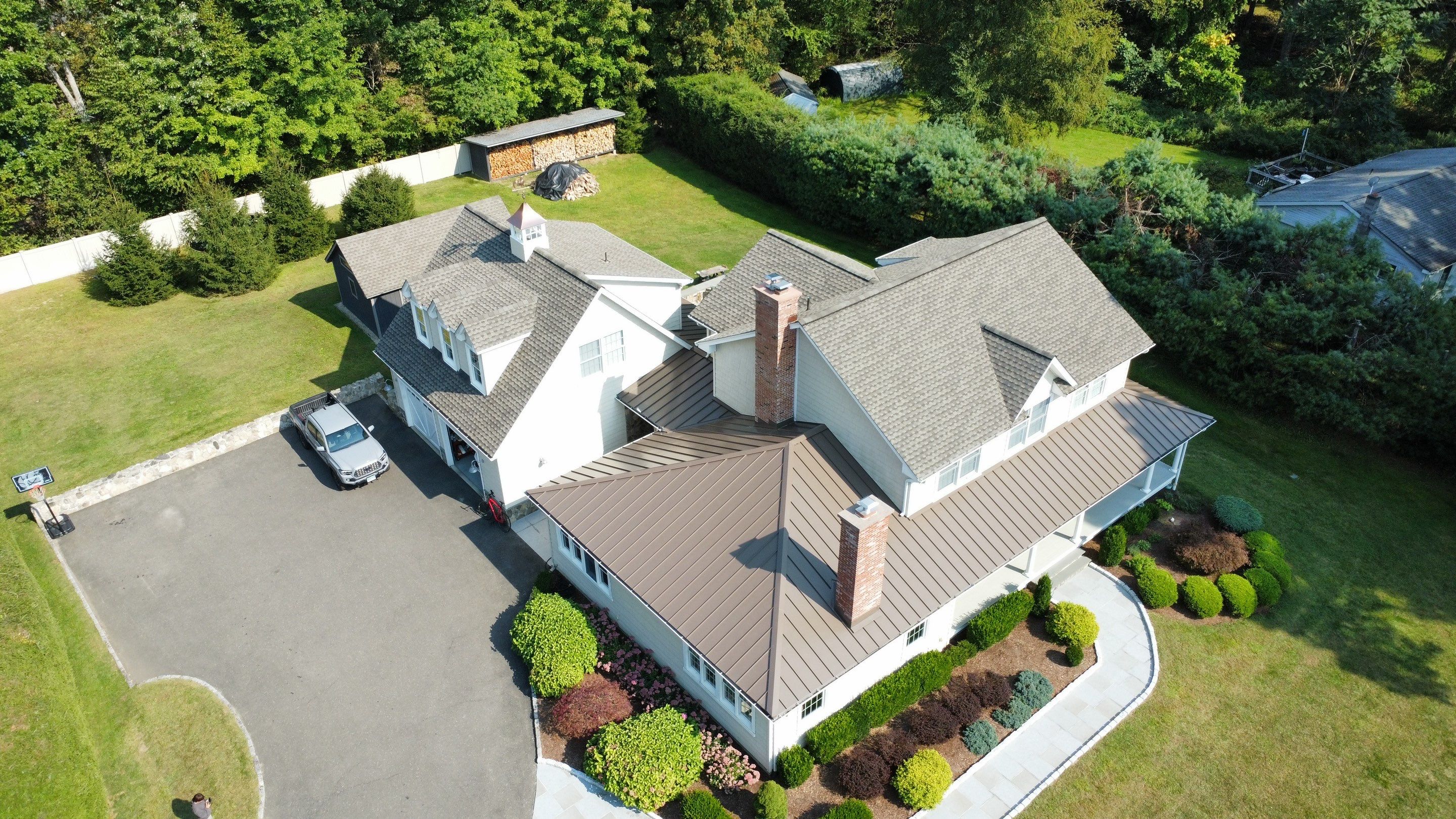 Asphalt & Standing Seam Metal Roof Replacement  by Lecla Home Improvements and Roofing INC