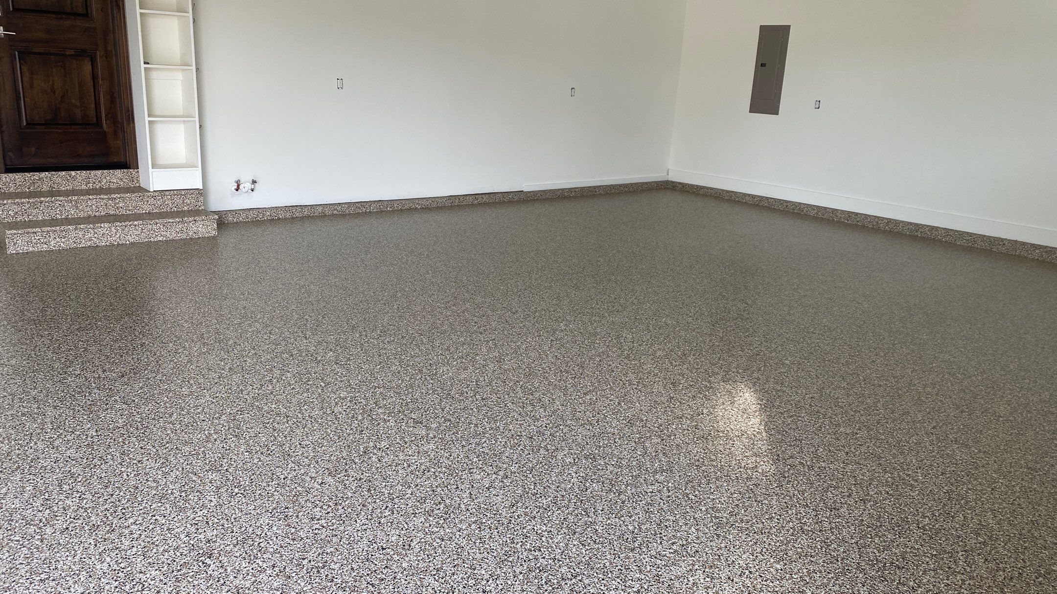 Kenny & Debbie transformed their garage with a Banner Garage Floor and cabinets by Banner Garage